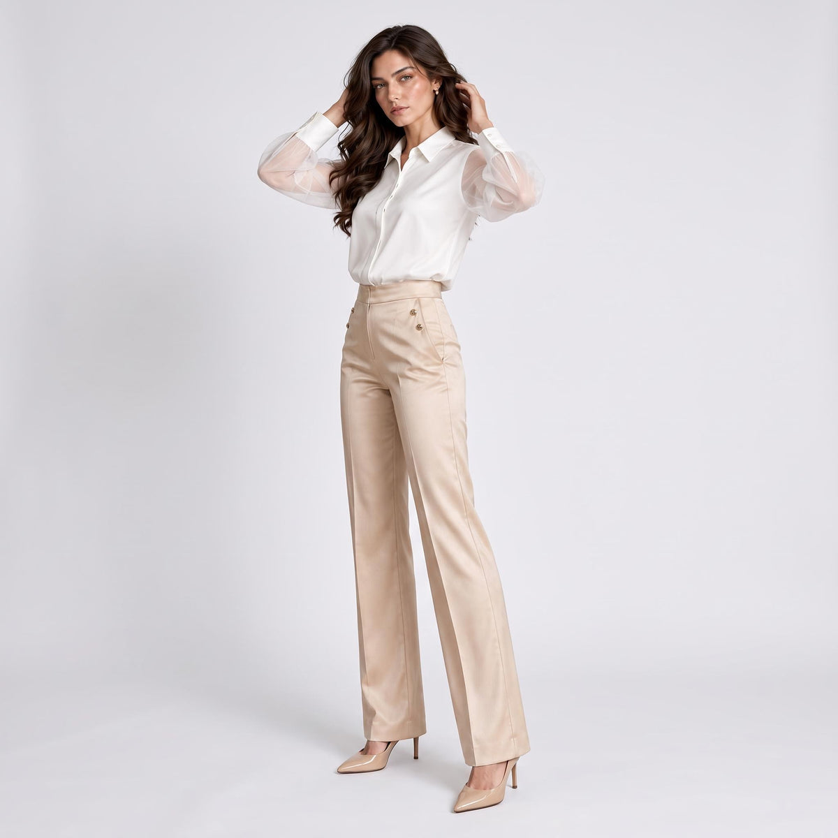 Elegant white silk blouse with sheer long sleeves, lapel collar, and button-up front paired with beige high-waisted trousers.