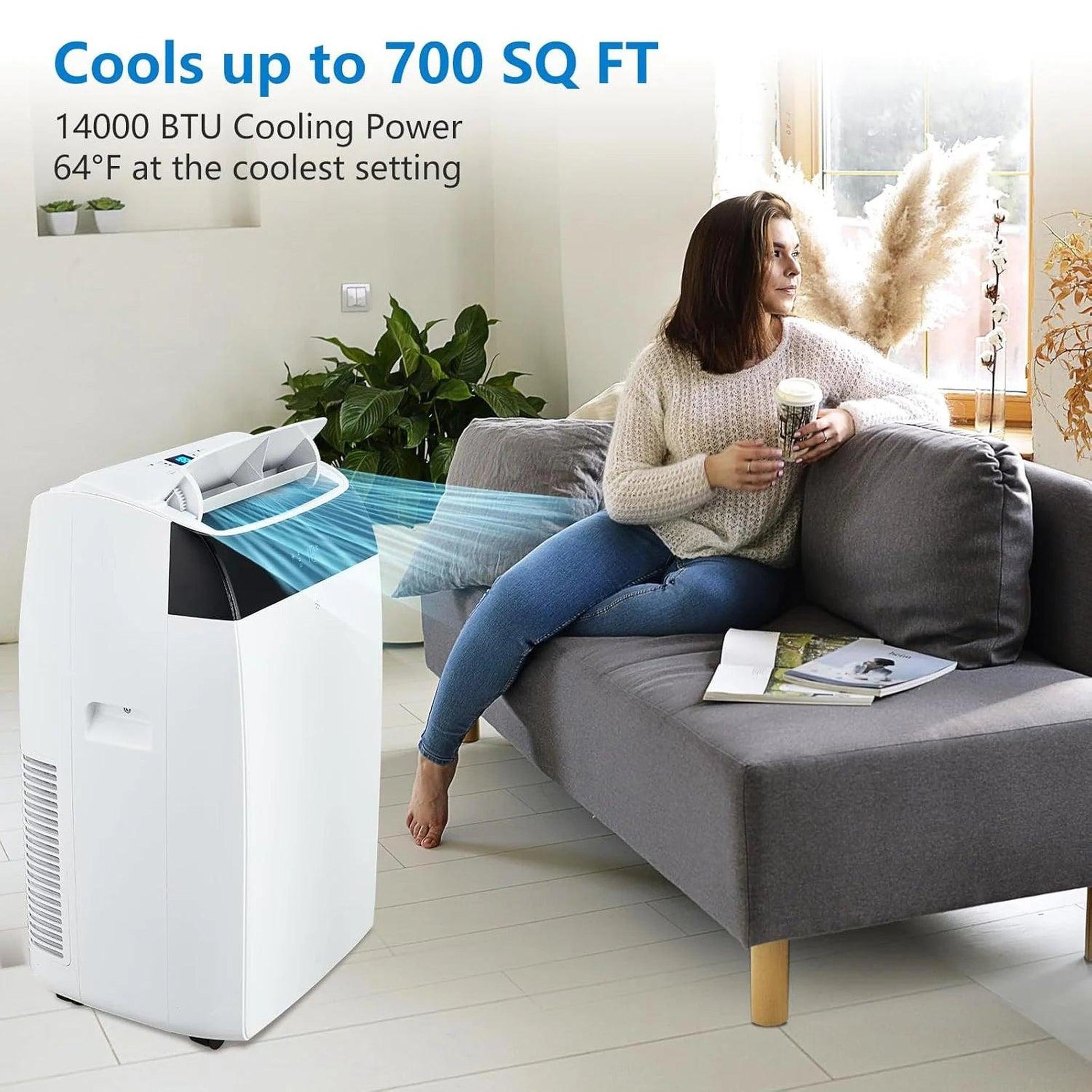 White 14000 BTU portable air conditioner cooling a living room with a woman on the sofa