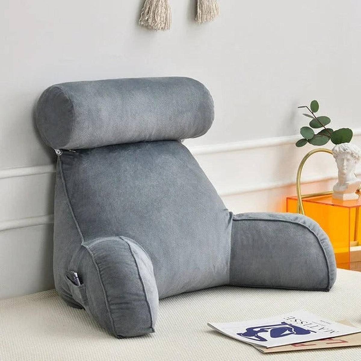 Gray velour adjustable backrest pillow with arms, headrest, and side pocket for bed or sofa.
