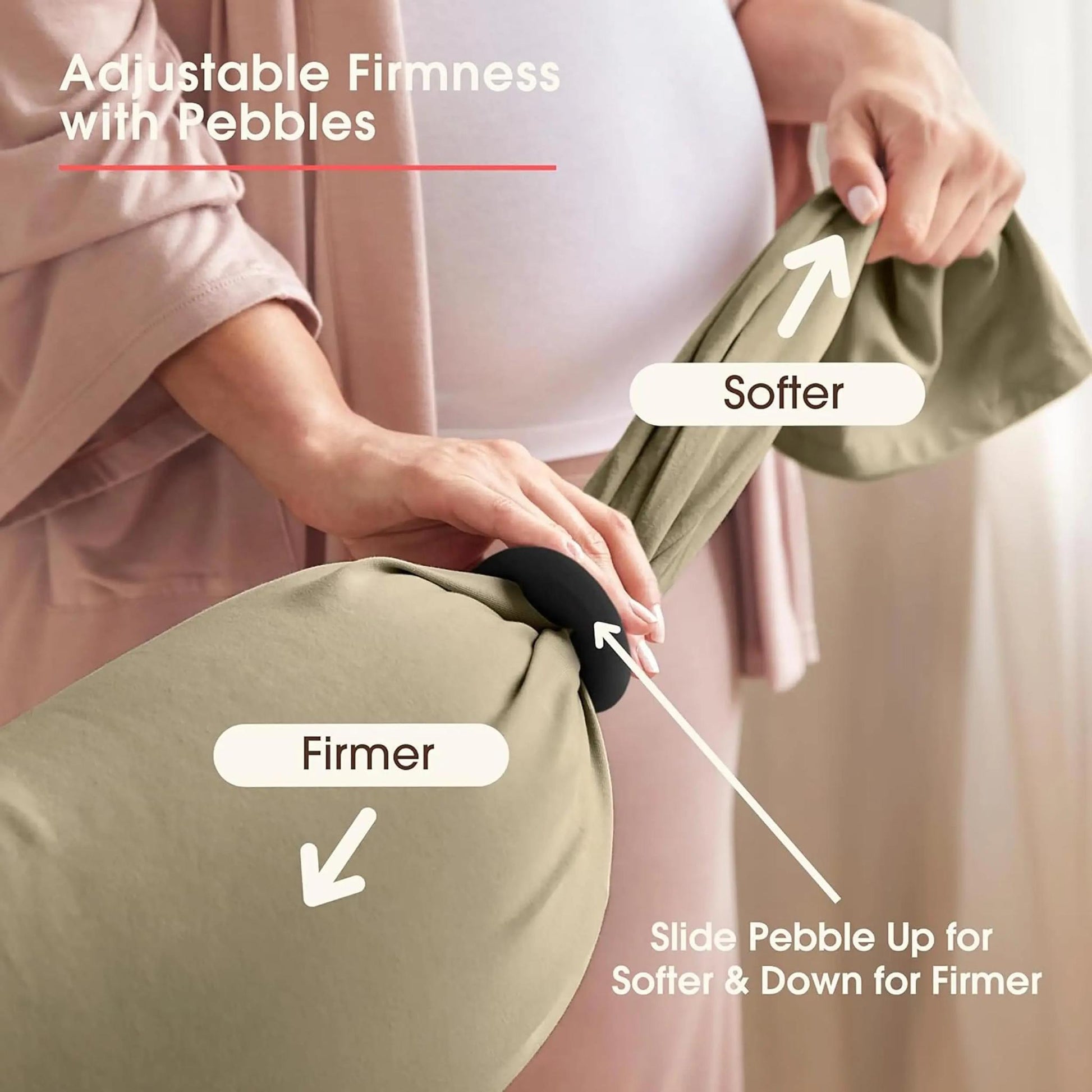 Pregnant woman adjusting a U-shaped body pillow with a black ring for customizable firmness.