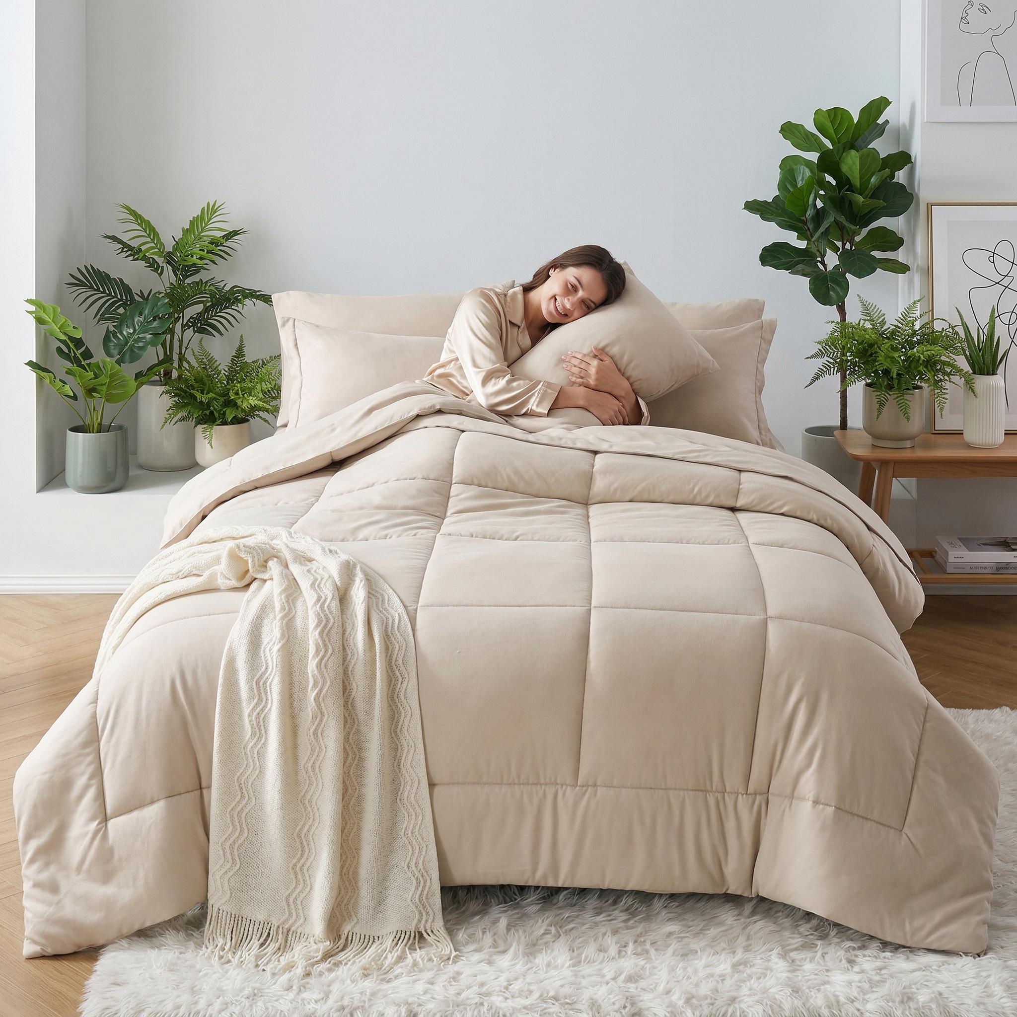 Beige down alternative duvet insert comforter set with a checkered pattern, on a bed with a woman.