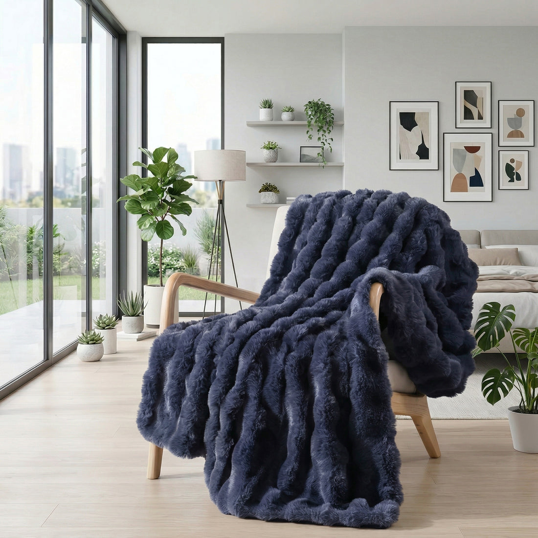 Woman in pajamas relaxing with a dark blue faux fur throw blanket and a cup of coffee.