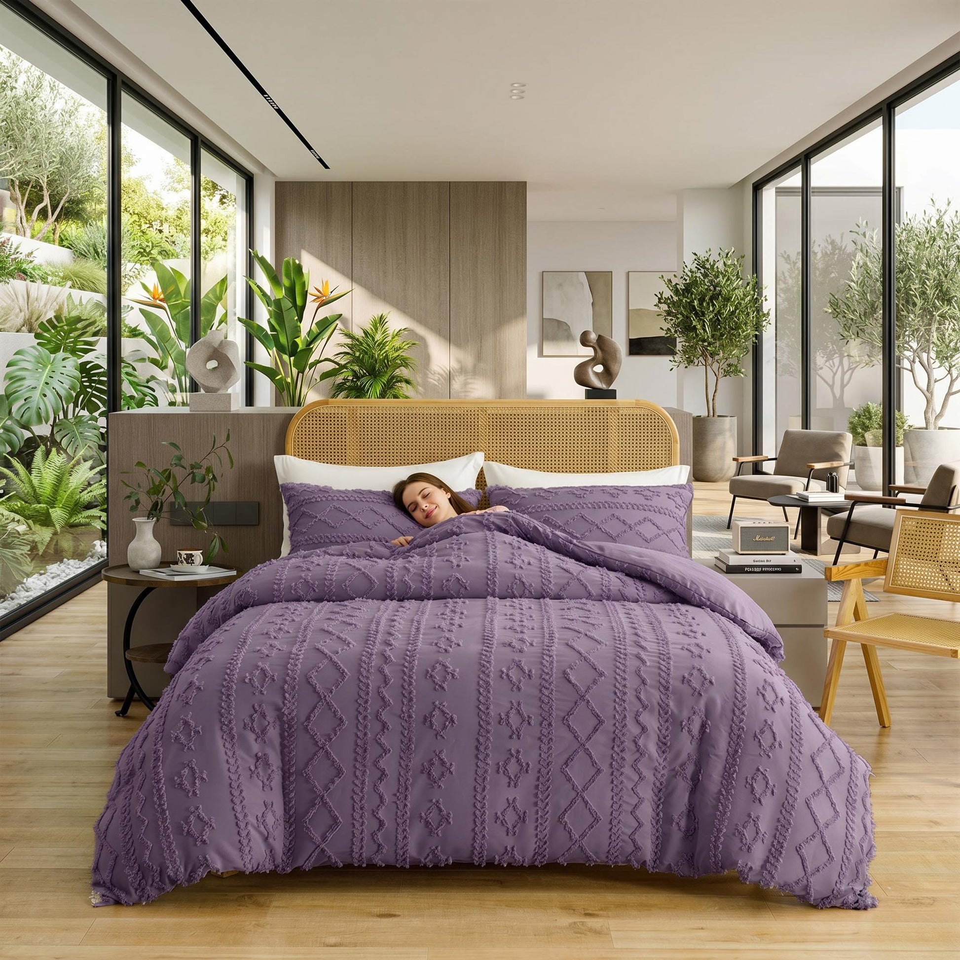 Queen size purple boho tufted comforter set with a sleeping person in a modern, plant-filled bedroom.