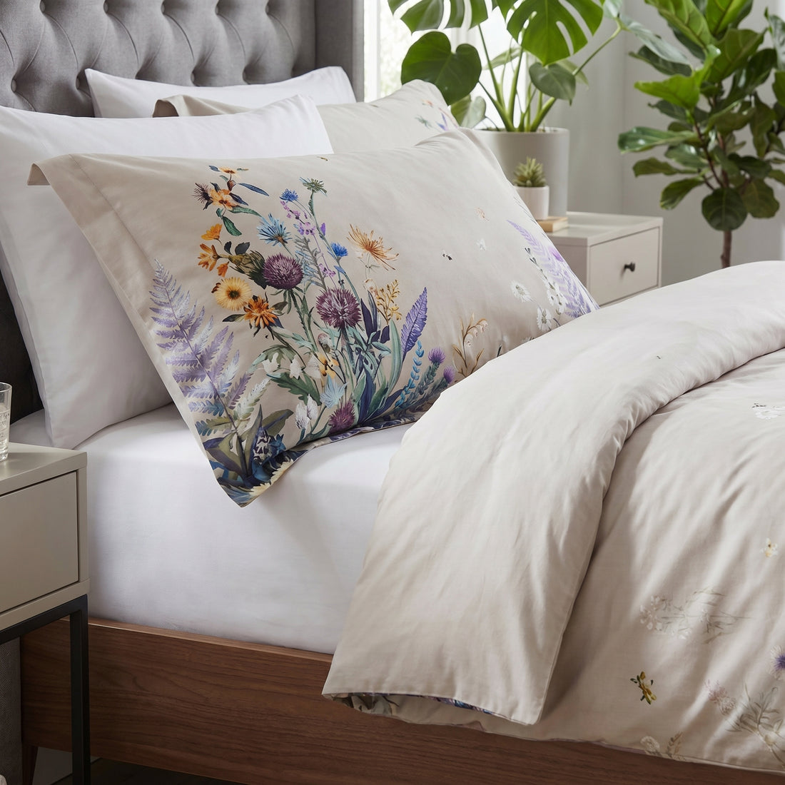 Botanical floral 500 thread count cotton duvet cover set with vibrant pink, purple, and blue flowers on a neutral base.