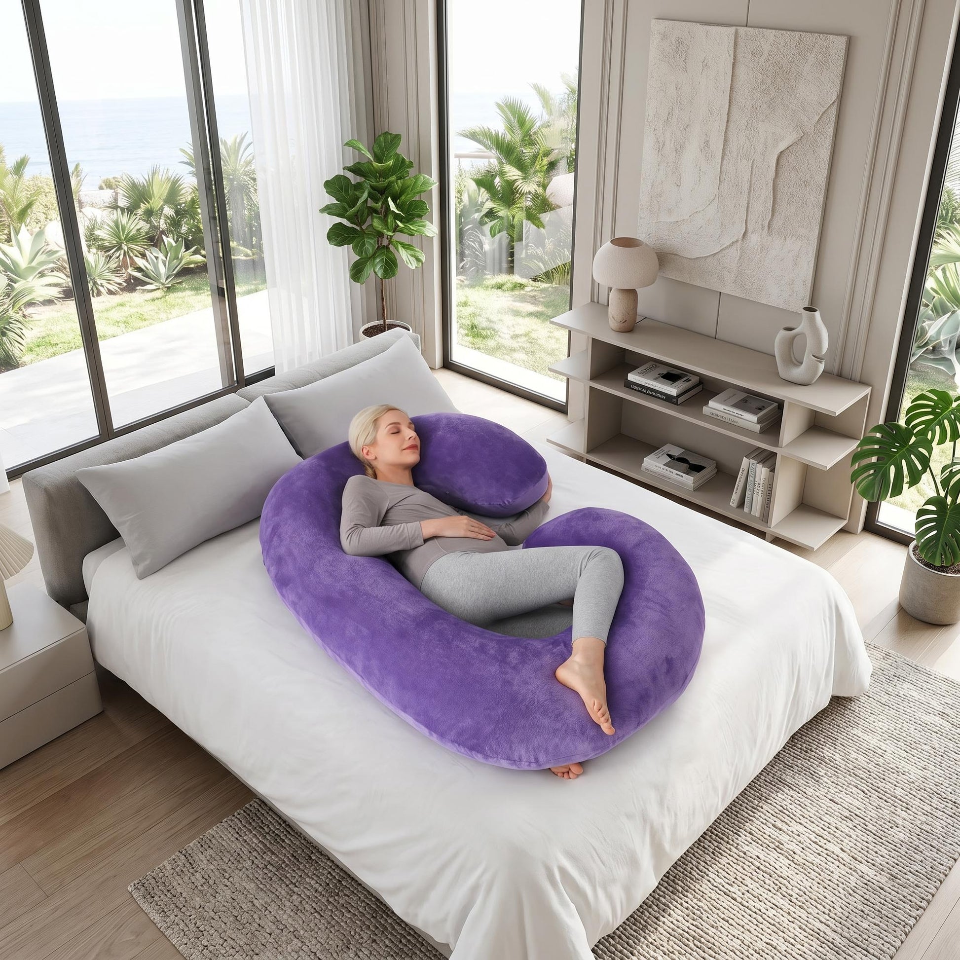 Woman resting on a large purple C-shaped support pillow on a white bed.