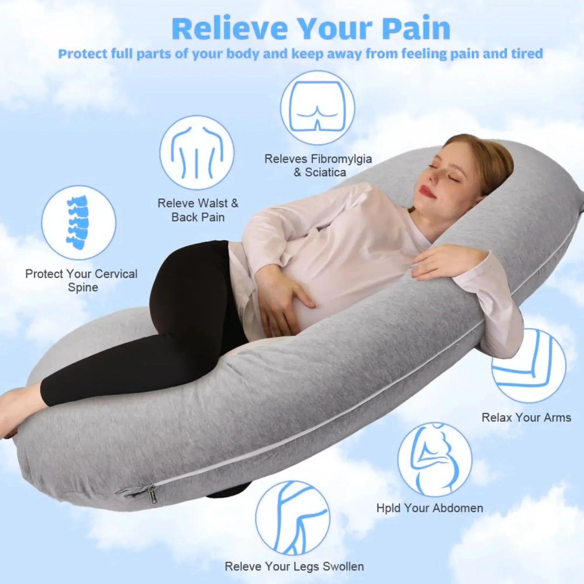 Pregnant woman resting on a large gray C-shaped support pillow, highlighting its full-body comfort.