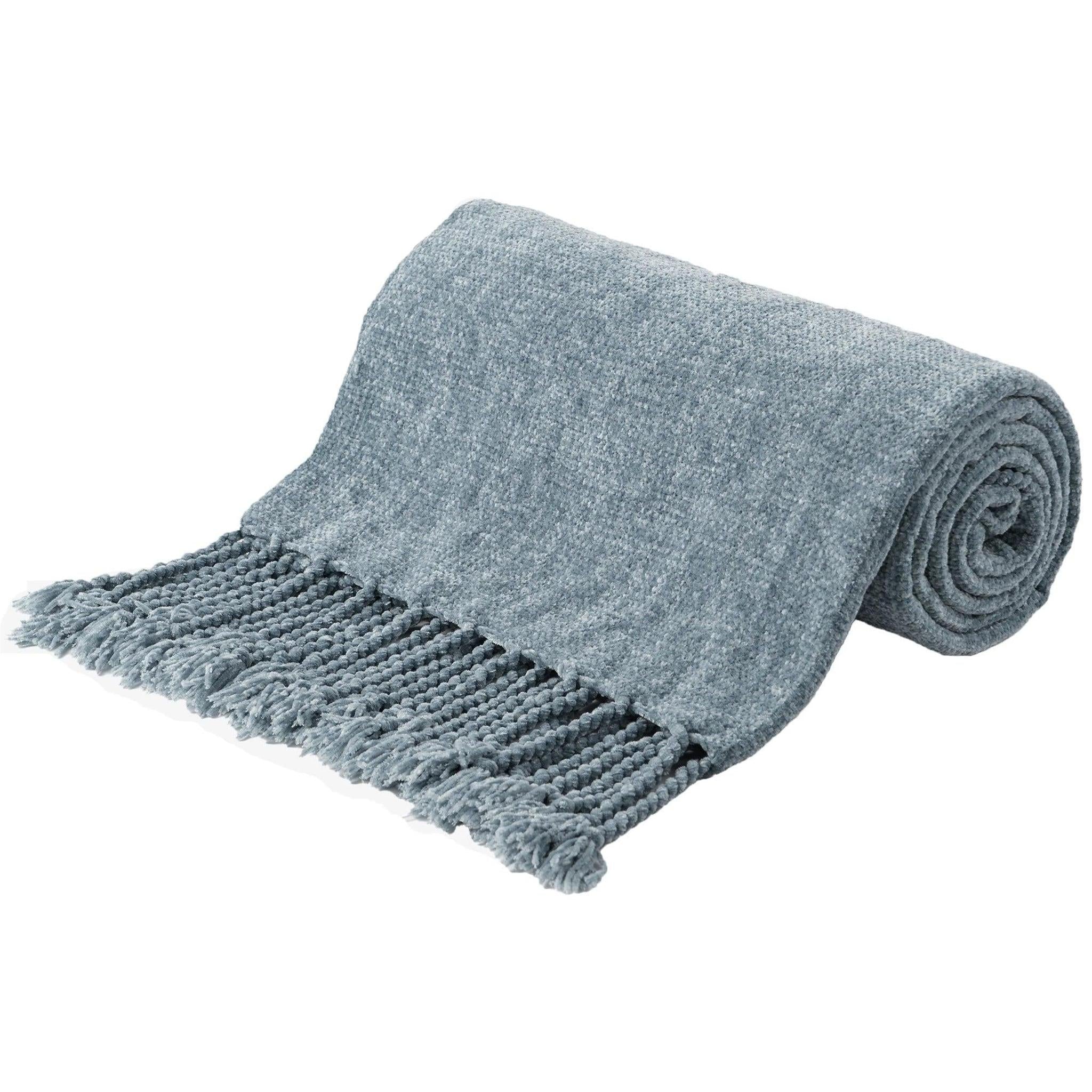 Light blue chenille throw blanket with fringe tassels, rolled on one end, showcasing its soft texture.
