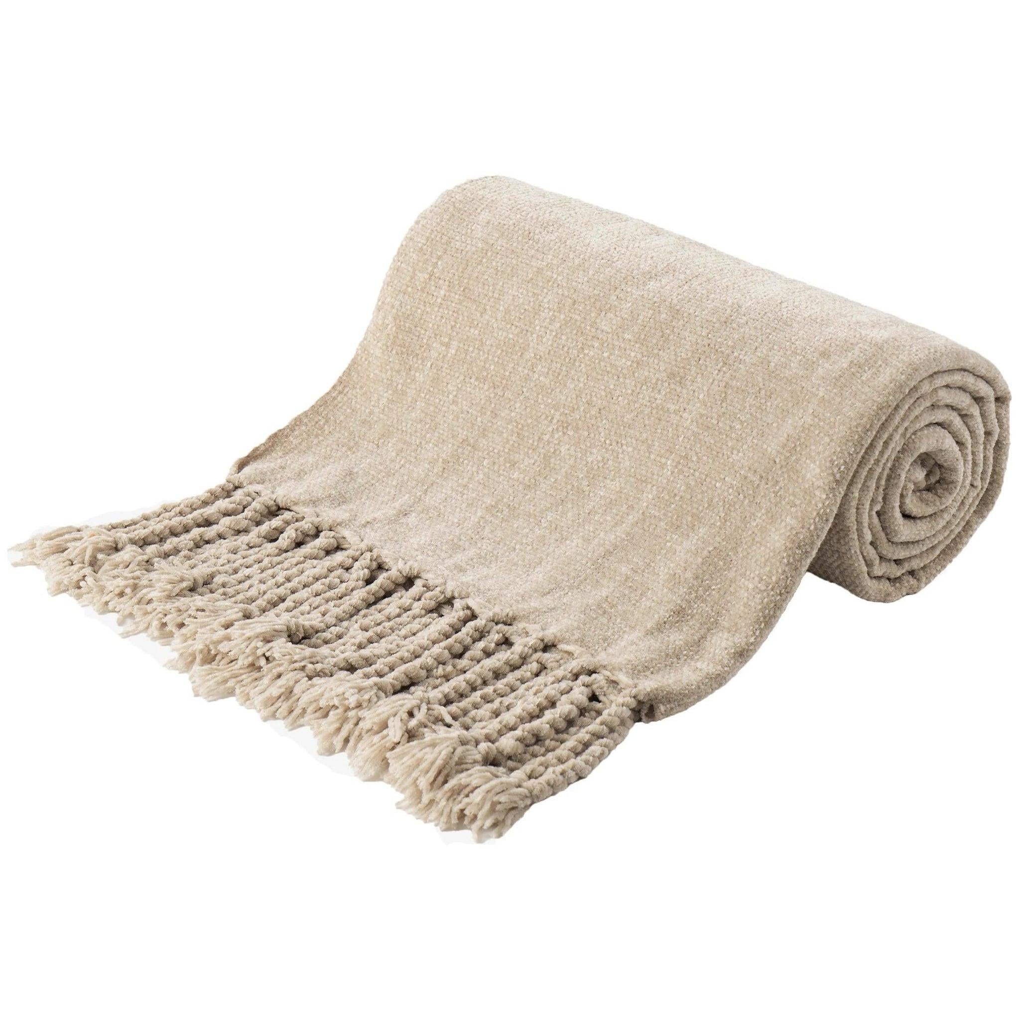 Rolled beige chenille throw blanket with fringe tassels, made from soft, breathable polyester.