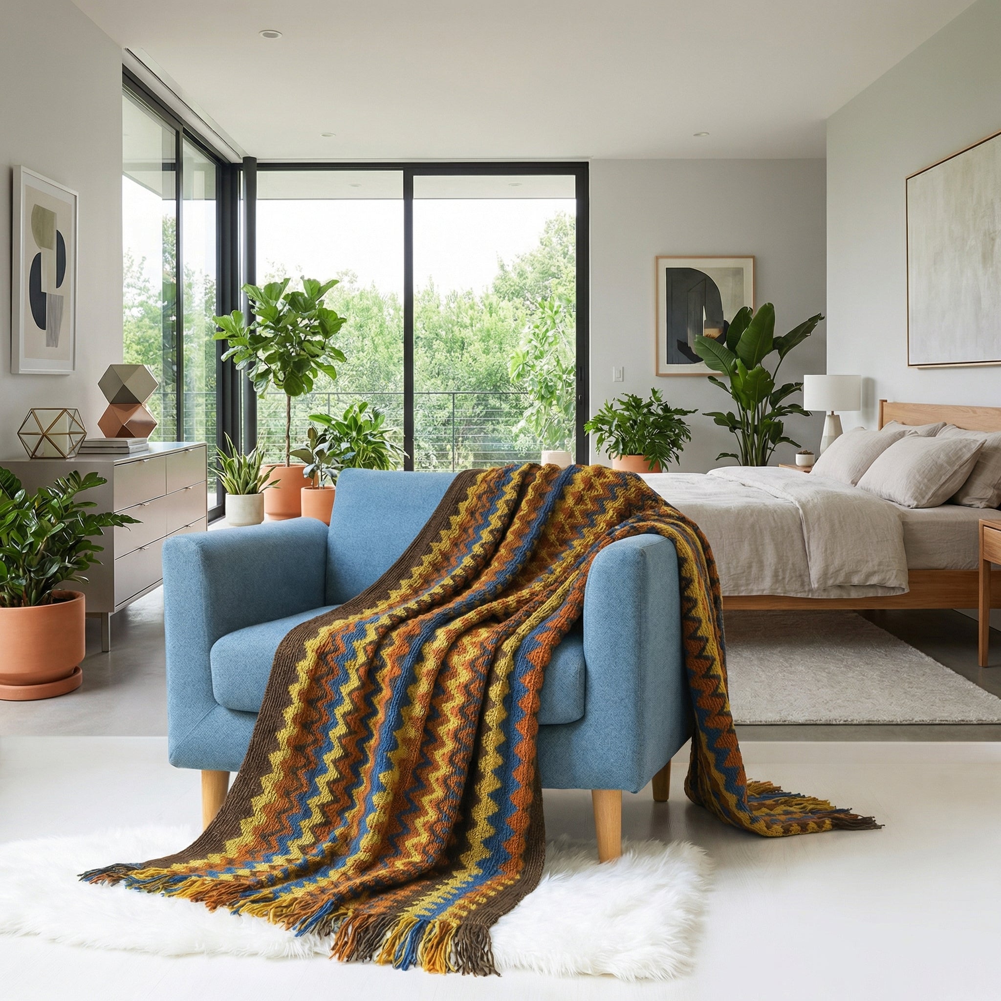 Chic hand-knitted acrylic blanket with a brown, blue, and orange chevron pattern draped over a blue armchair.