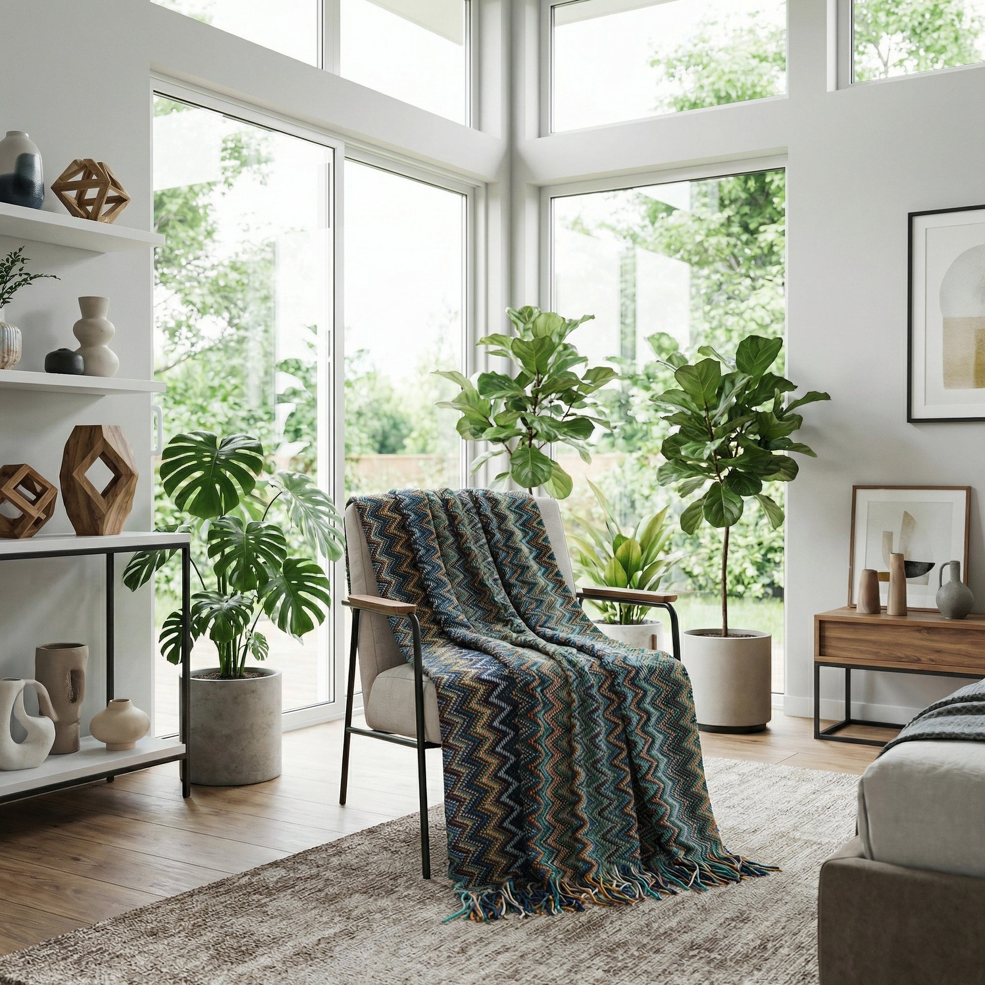 Chic hand-knitted blanket with a blue, green, and yellow chevron pattern and tassels draped over an armchair.