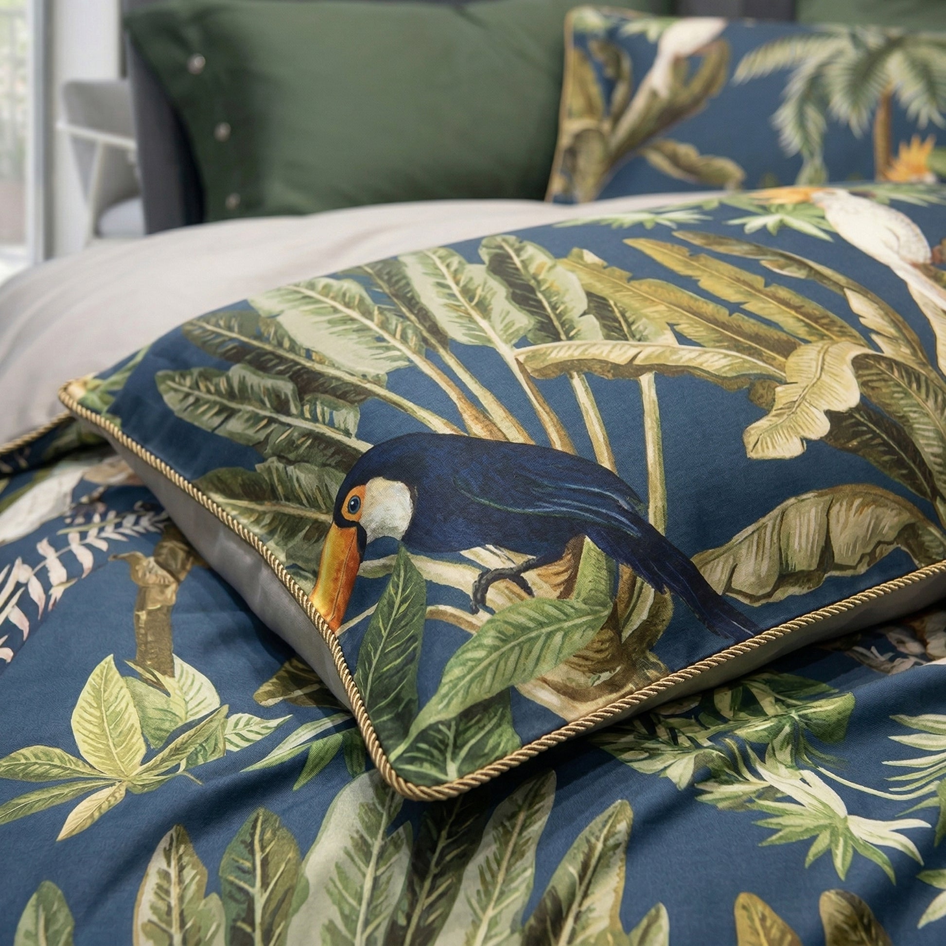 Navy blue duvet cover set with tropical toucan and palm leaf print, cotton material.