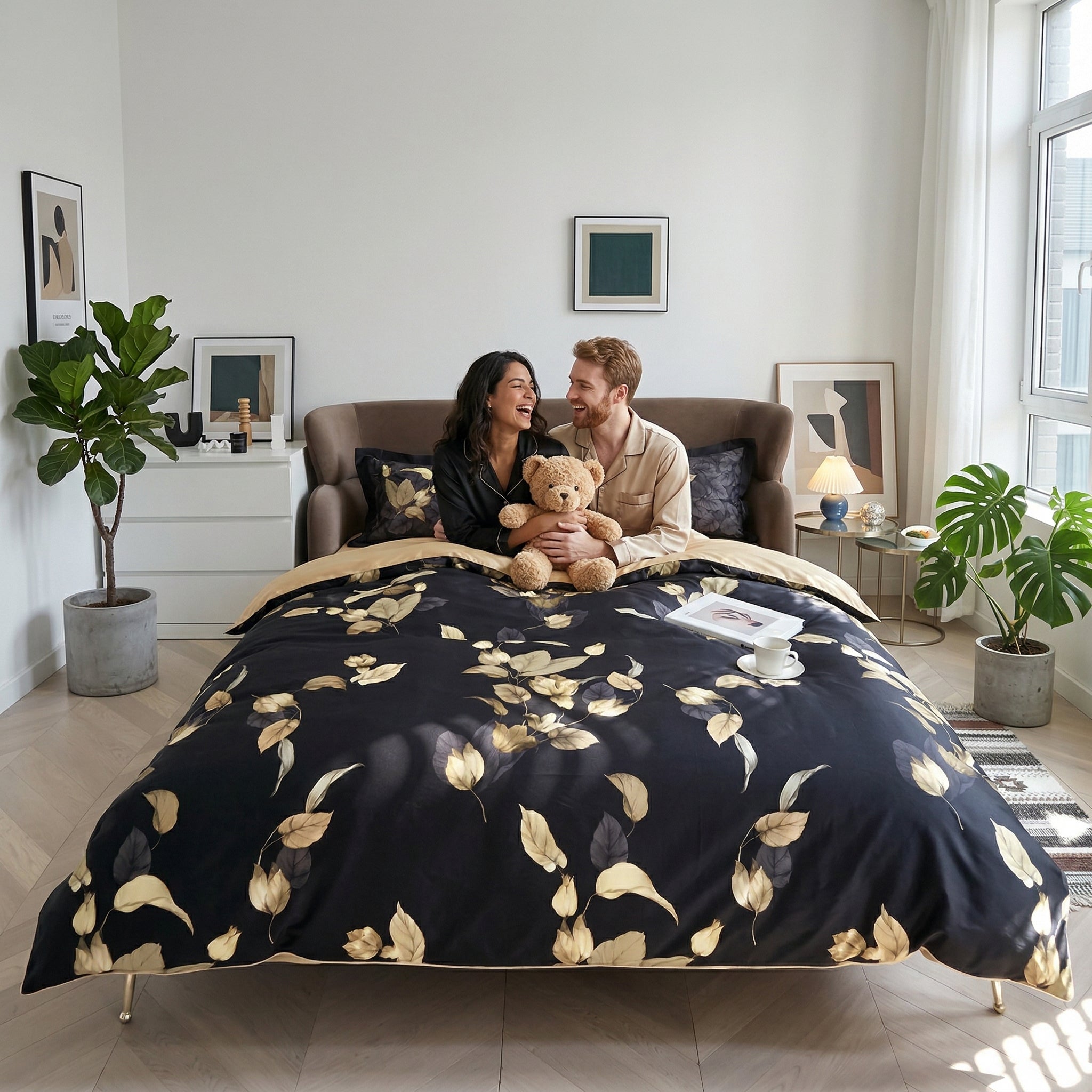 Couple on a bed with a black and gold Chinoiserie birds and flowers Egyptian cotton duvet cover set.