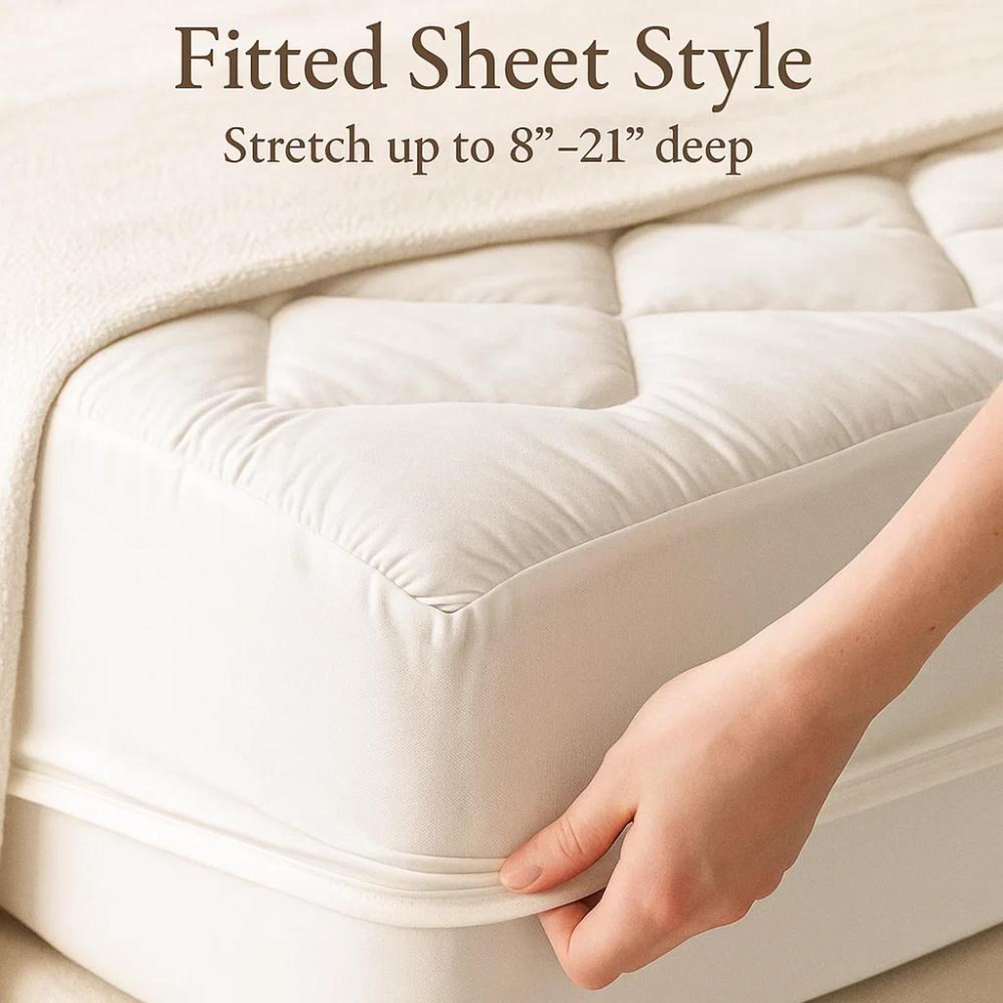 White quilted cooling mattress topper with a fitted sheet style, shown being stretched over a mattress.