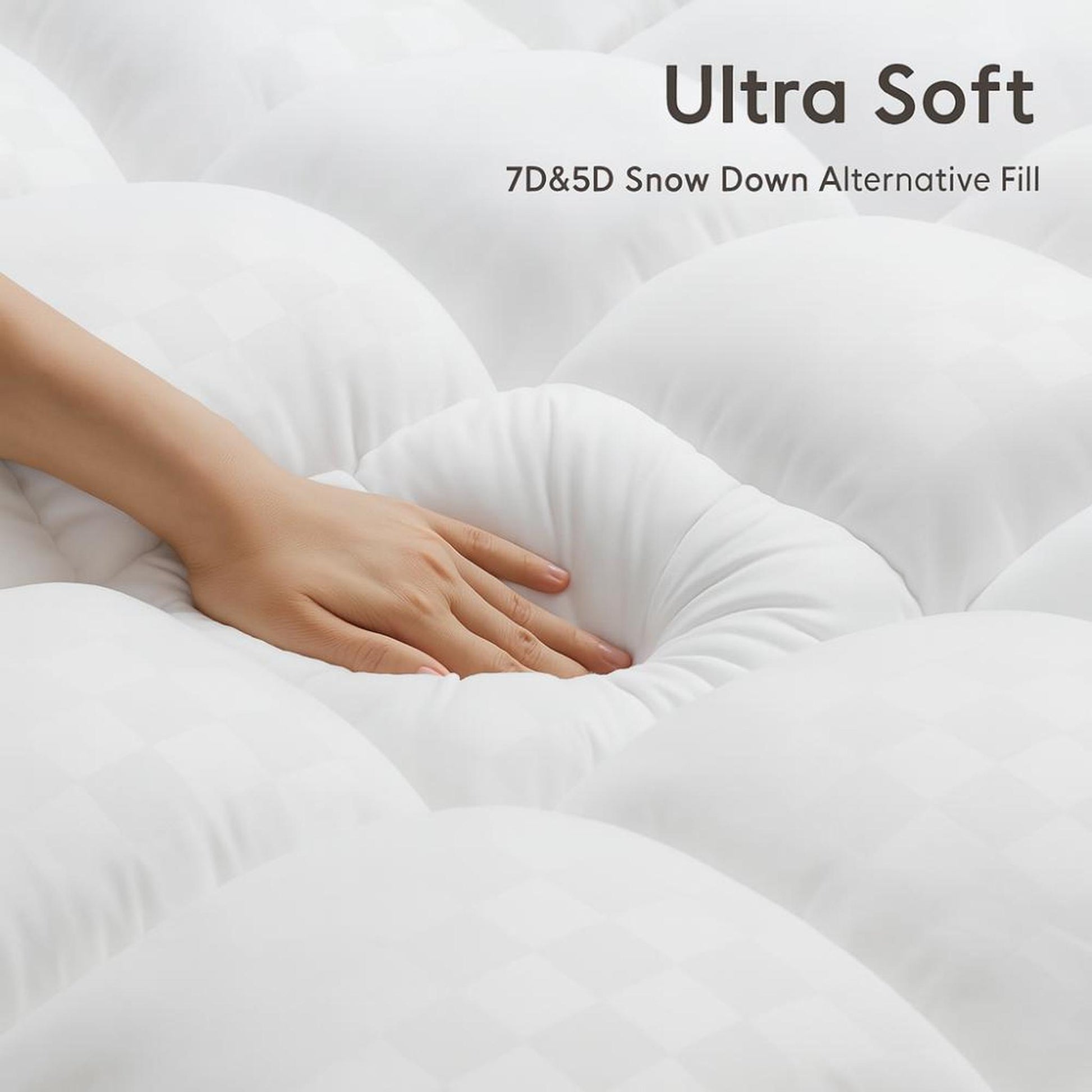 Hand touching a white, quilted CloudLift Cooling Mattress Topper with soft, breathable fabric.