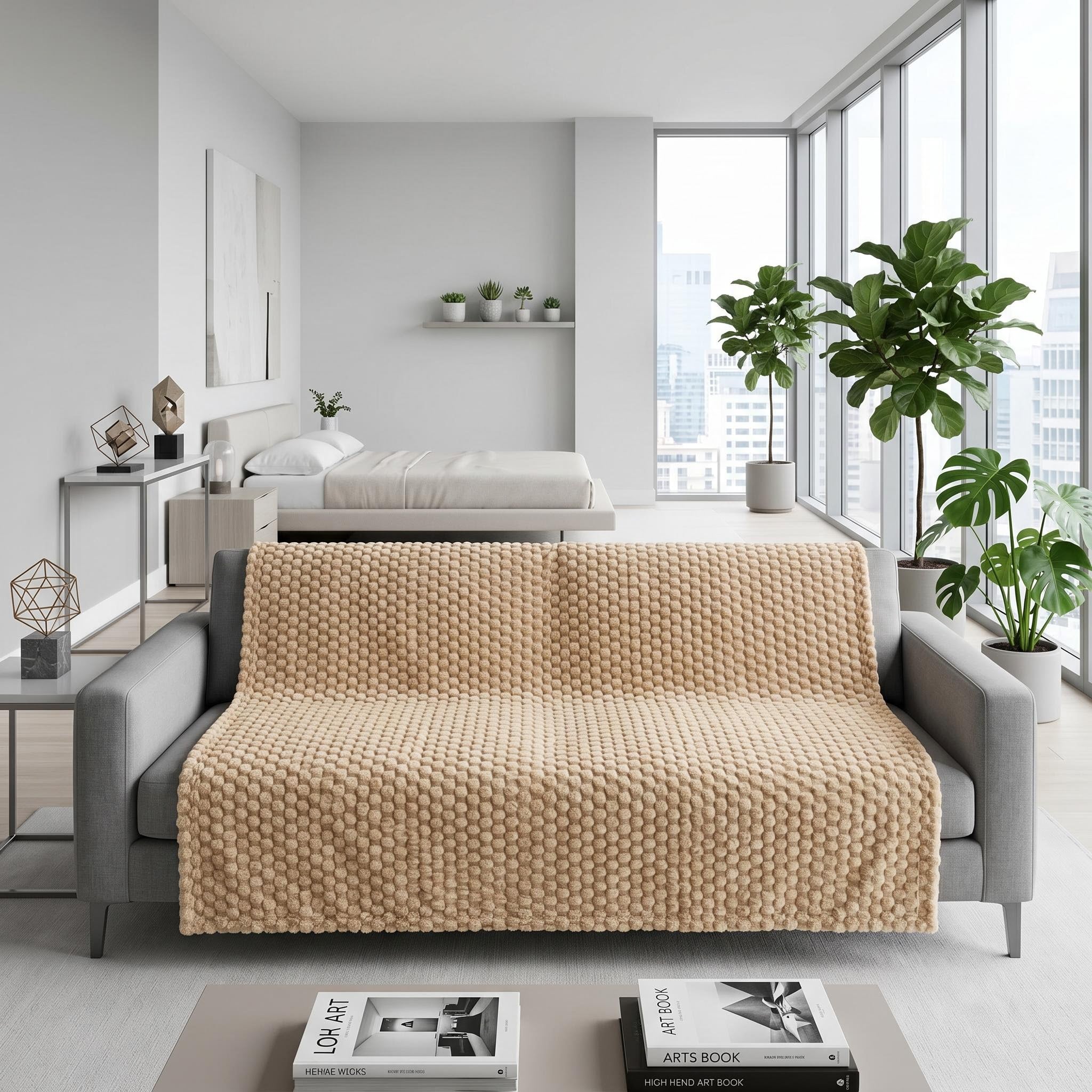 Beige Clouds Jacquard Fleece Blanket draped over a gray sofa in a modern living space.