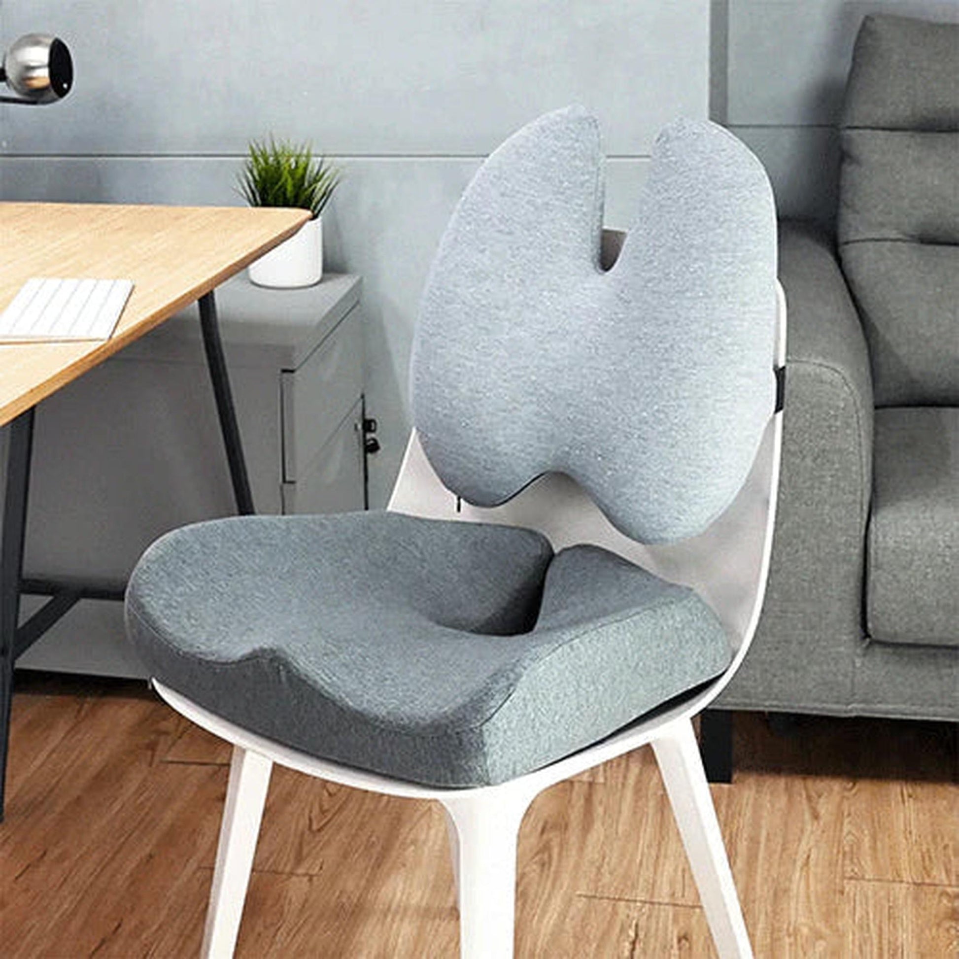 Gray ergonomic foam seat and back support cushion set on a white chair.