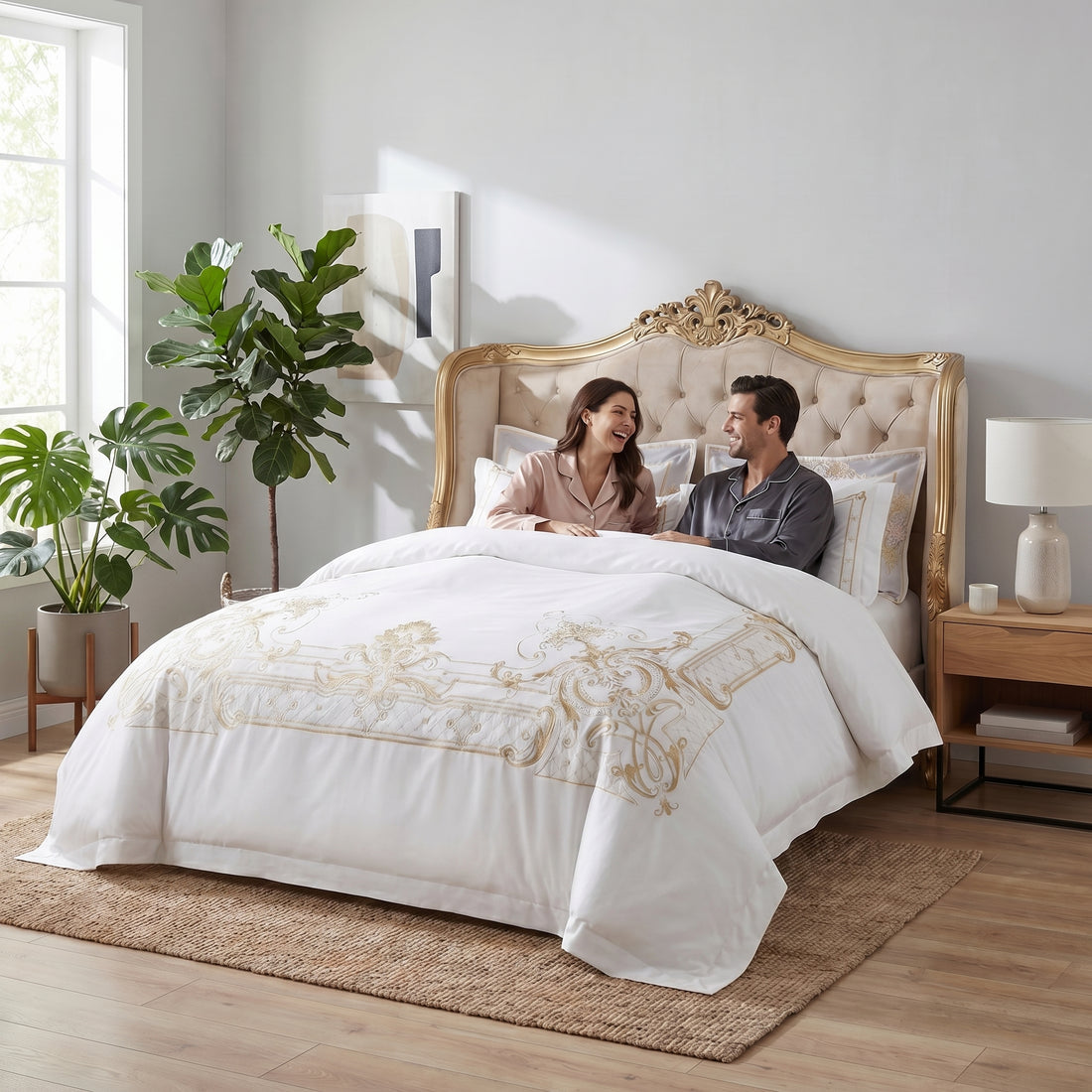 White Egyptian cotton duvet cover set with elegant gold geometric embroidery on a tufted bed in a modern bedroom.