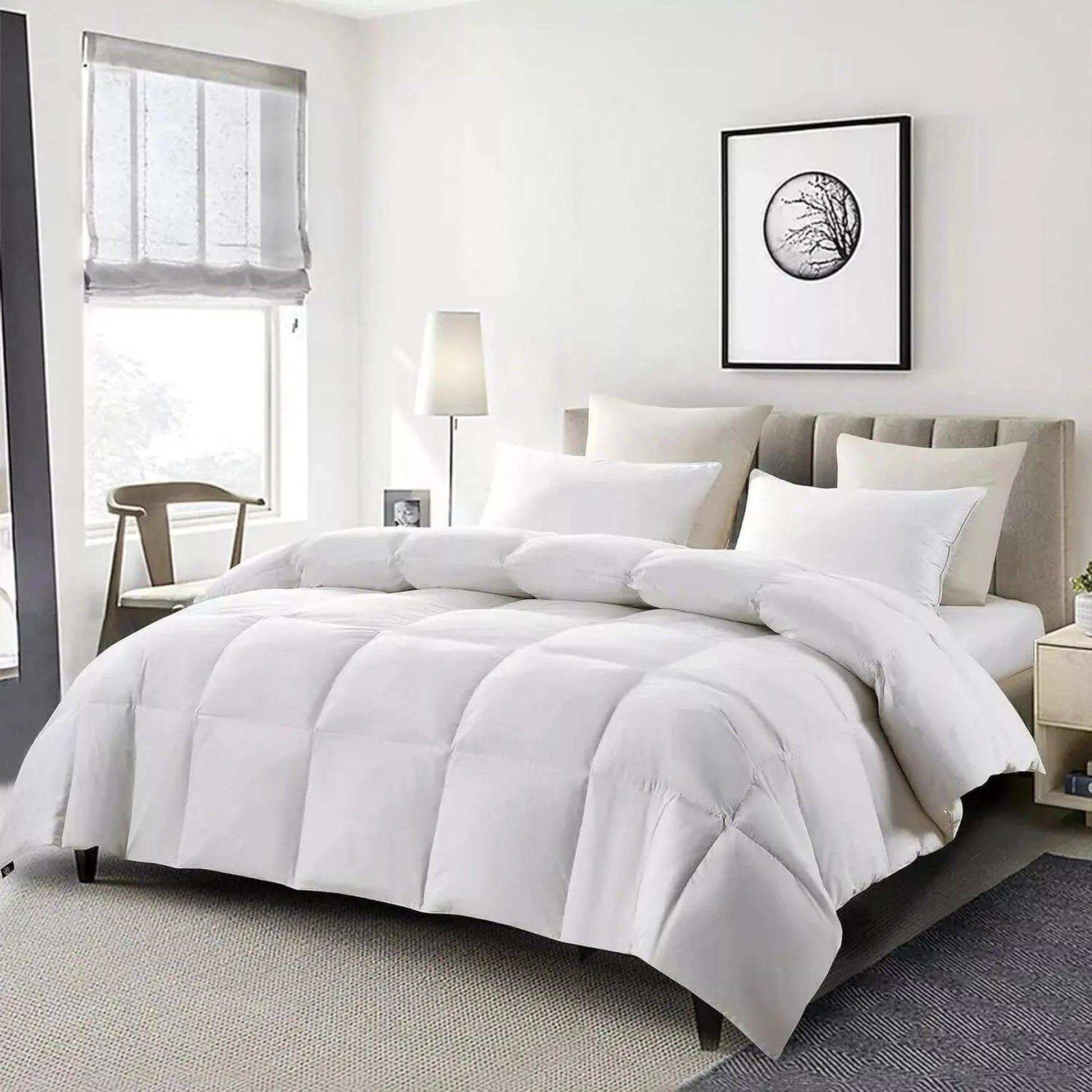 White goose down cooling comforter on a bed, featuring a soft, airy texture and thickened quilt design.
