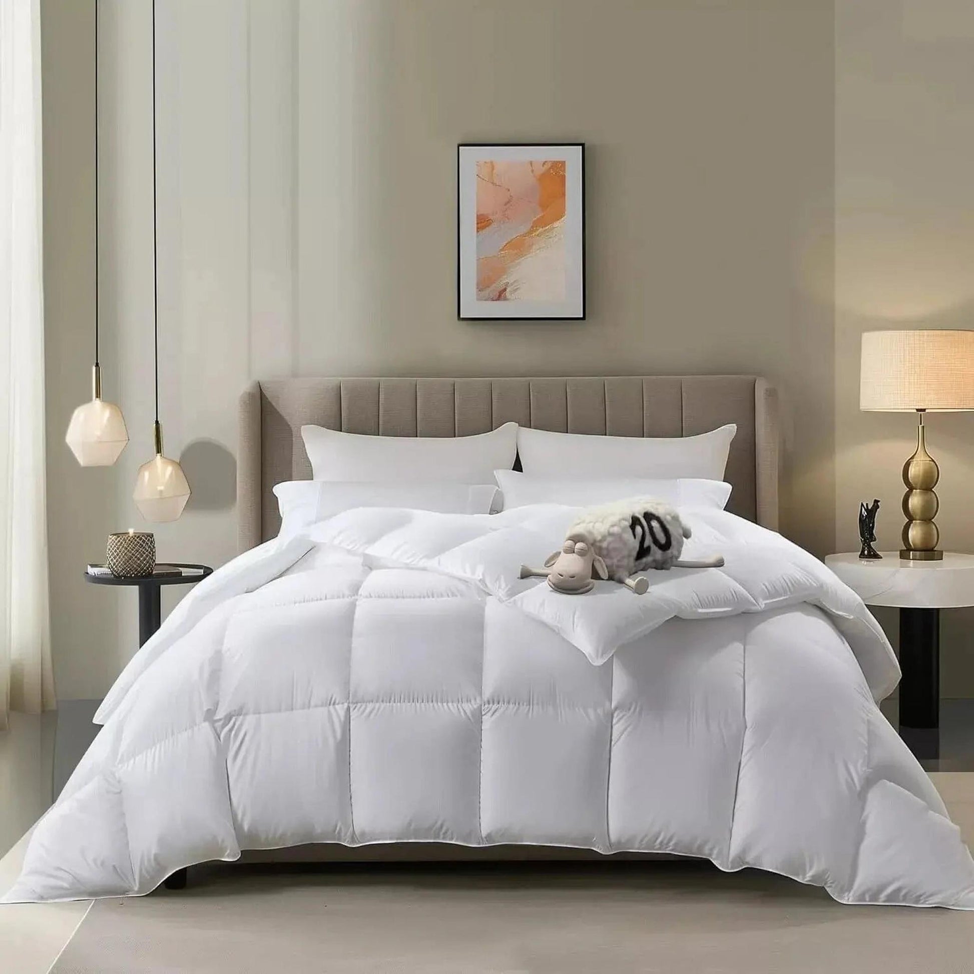 White goose down cooling comforter on a bed with a plush sheep toy, showcasing its soft, airy texture.