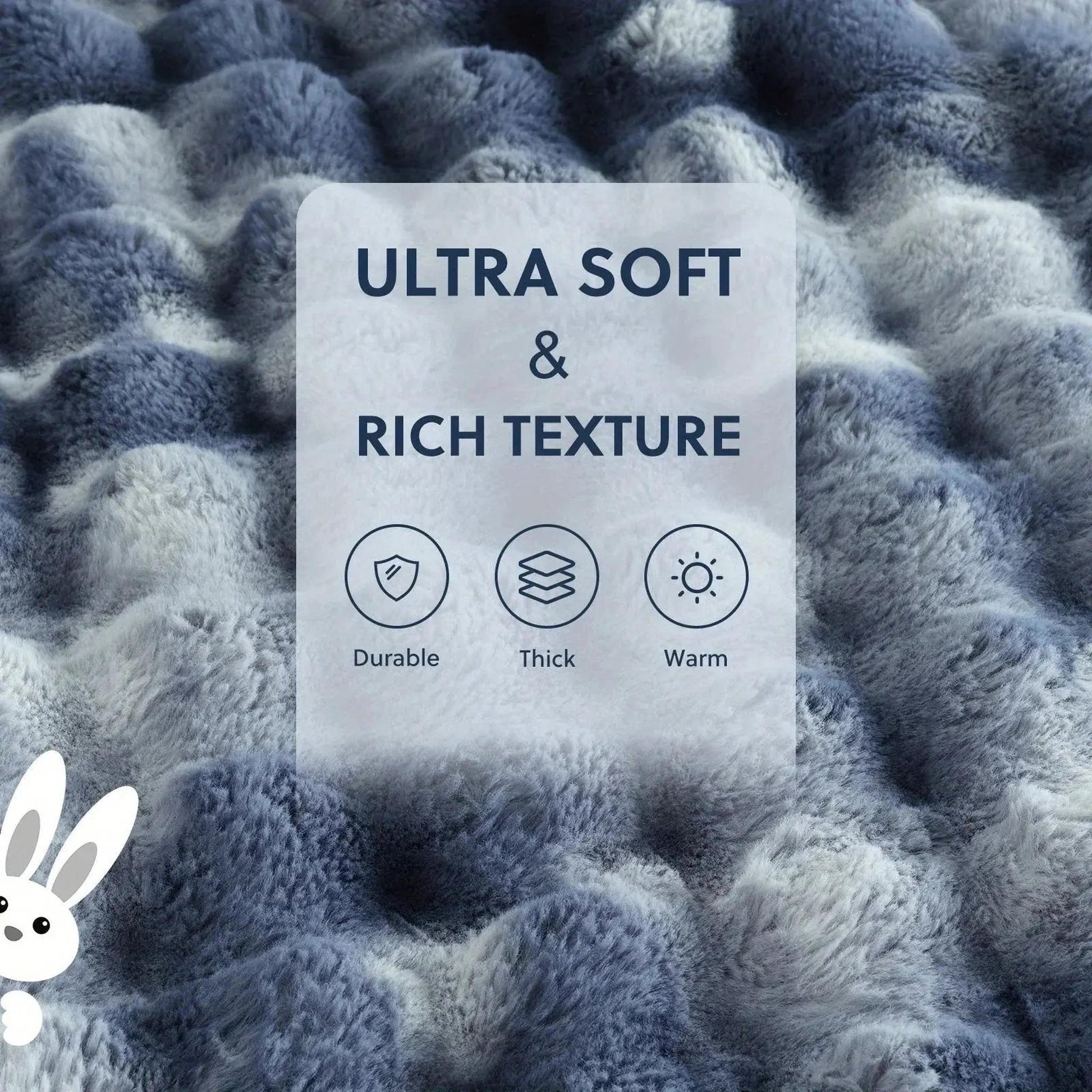 Close-up of a blue and white faux rabbit fleece throw blanket with a rich, plush texture.