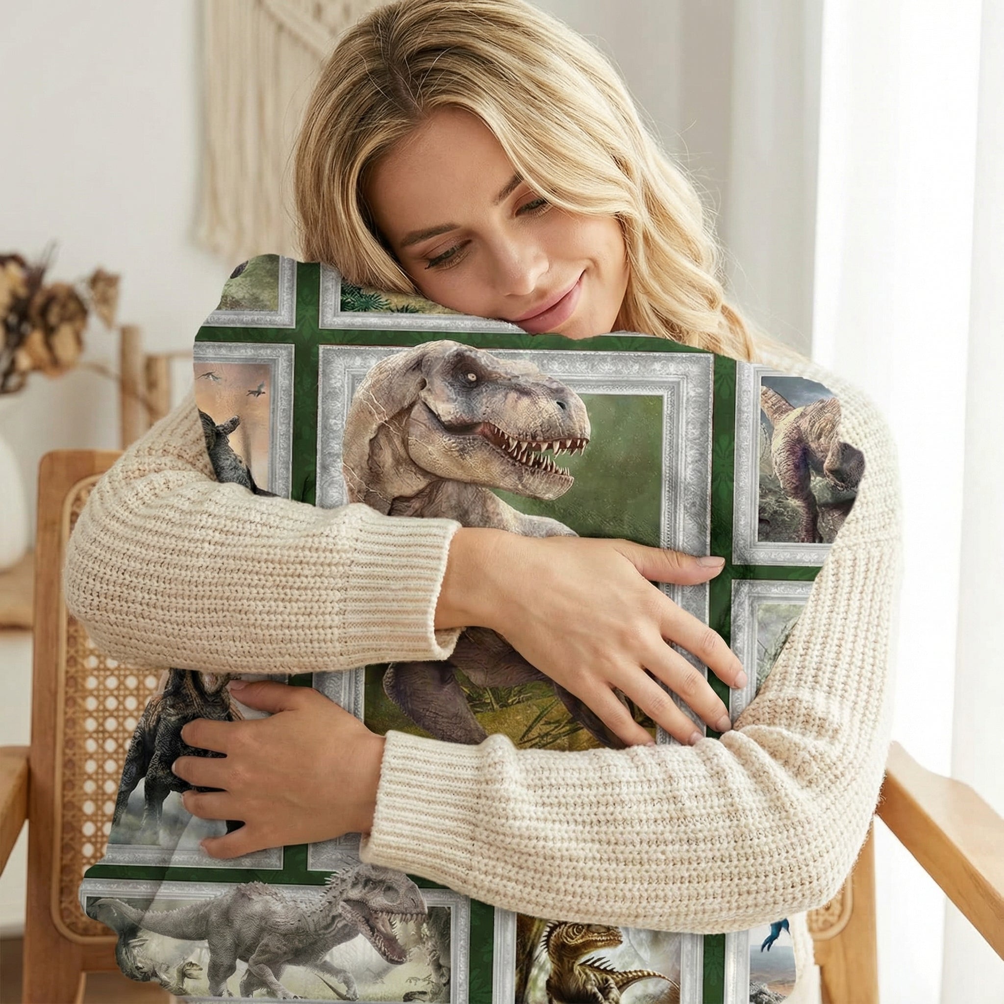 Blonde woman hugging a soft flannel fleece throw blanket with a vibrant dinosaur design in framed squares.