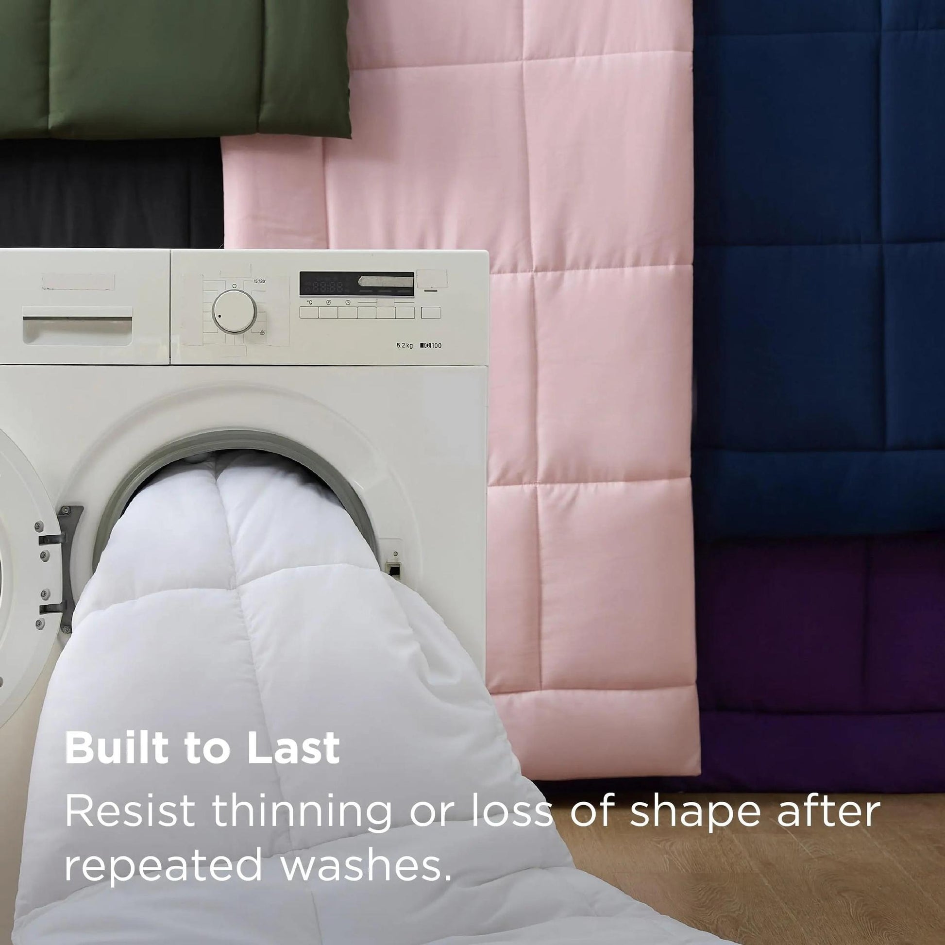 White down alternative comforter with box stitch design being washed, surrounded by colorful comforters.