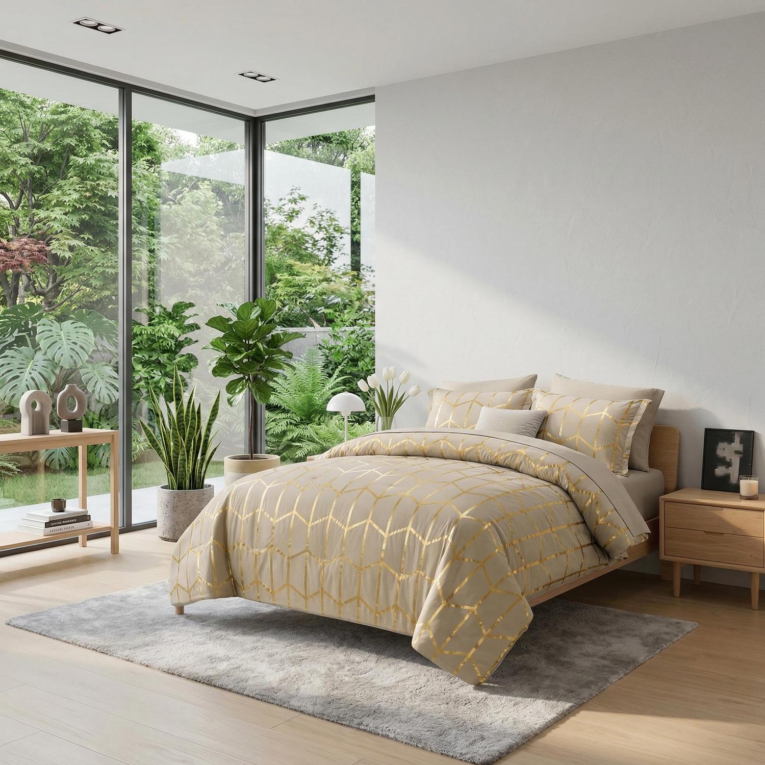 Elegant gold foil geometric comforter set on a bed in a bright room with large windows.