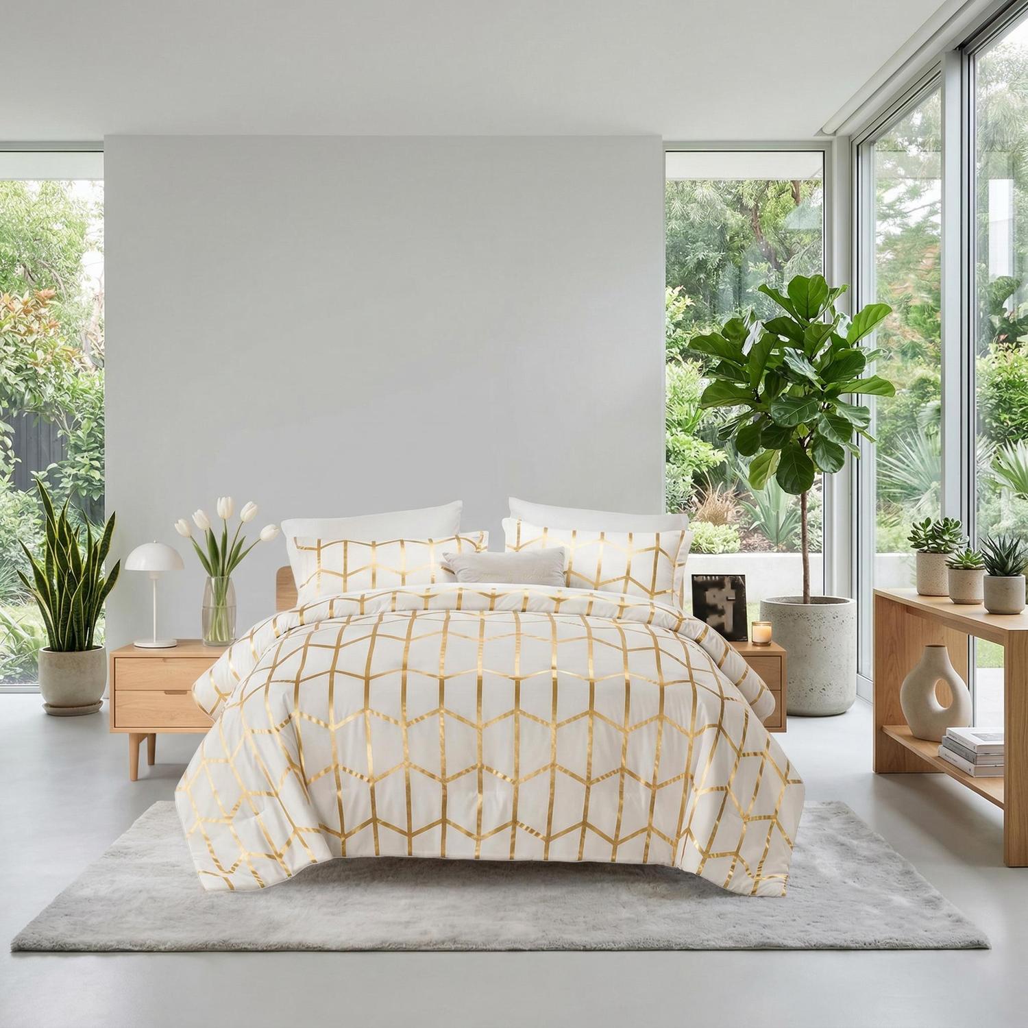 White comforter set with elegant gold foil geometric design on a bed in a bright room.