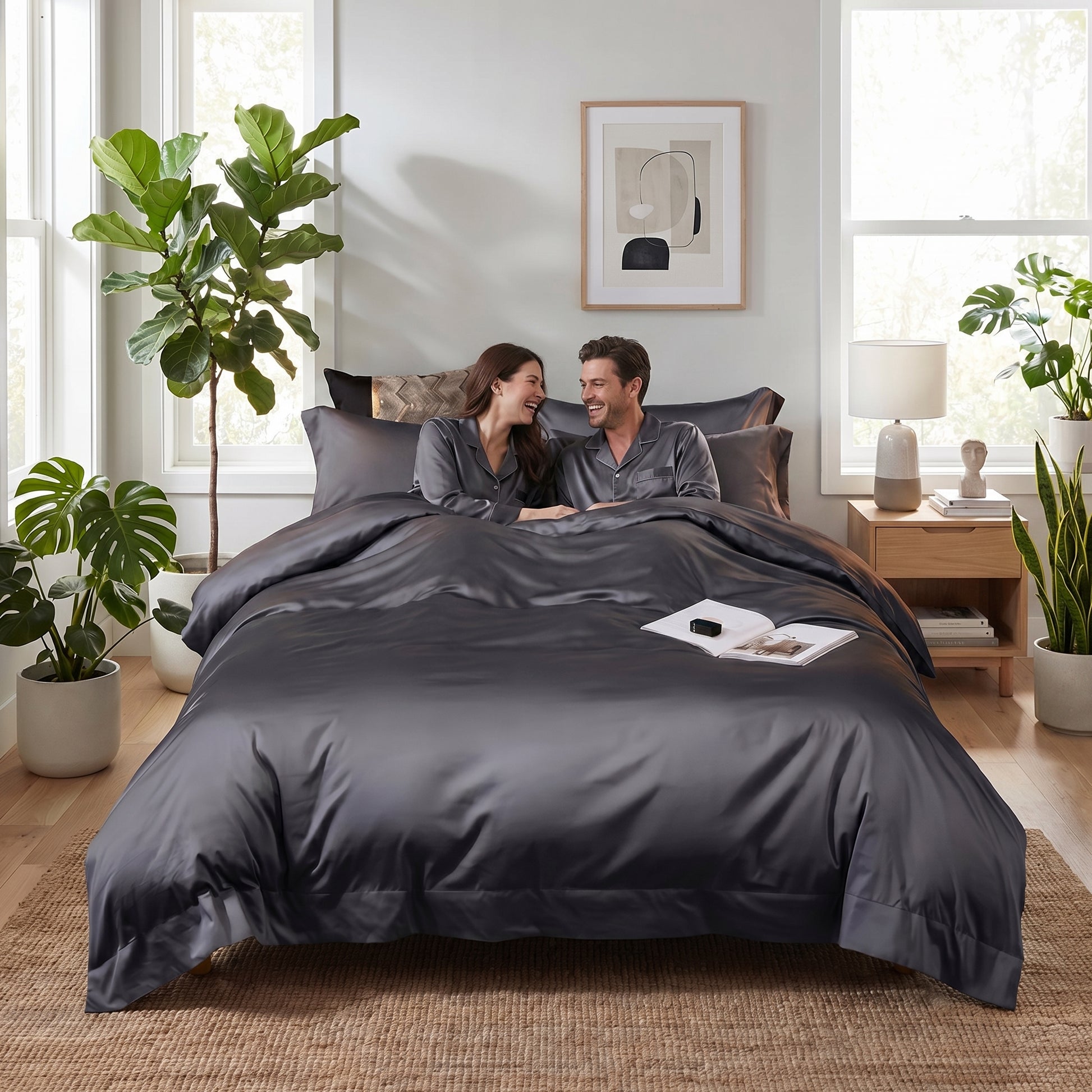 Elegant grey cotton sateen bedding set with a subtle sheen, featuring a duvet cover and pillows on a bed.