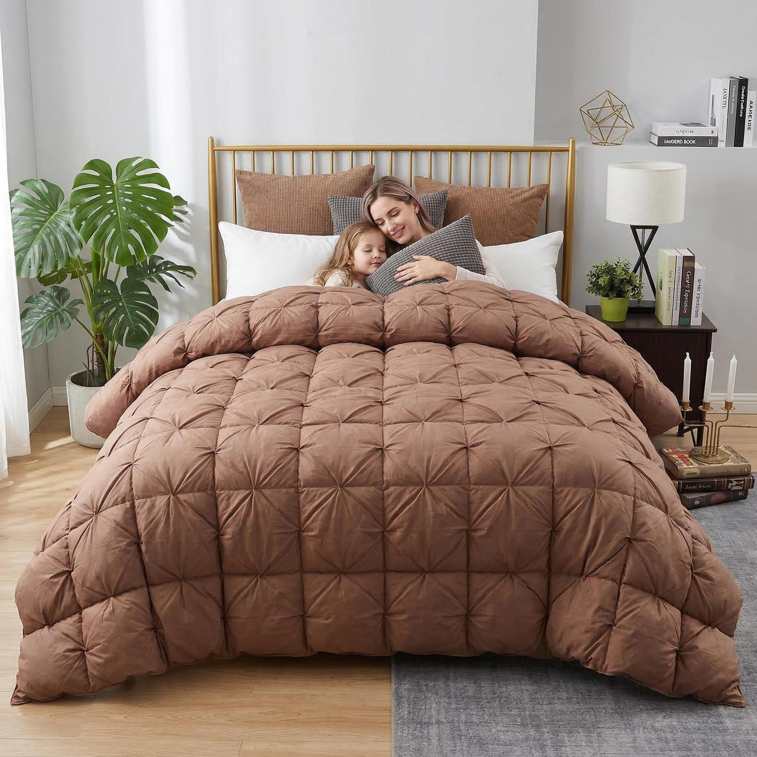 Brown goose down comforter with twist flower design on a bed with a woman and child.