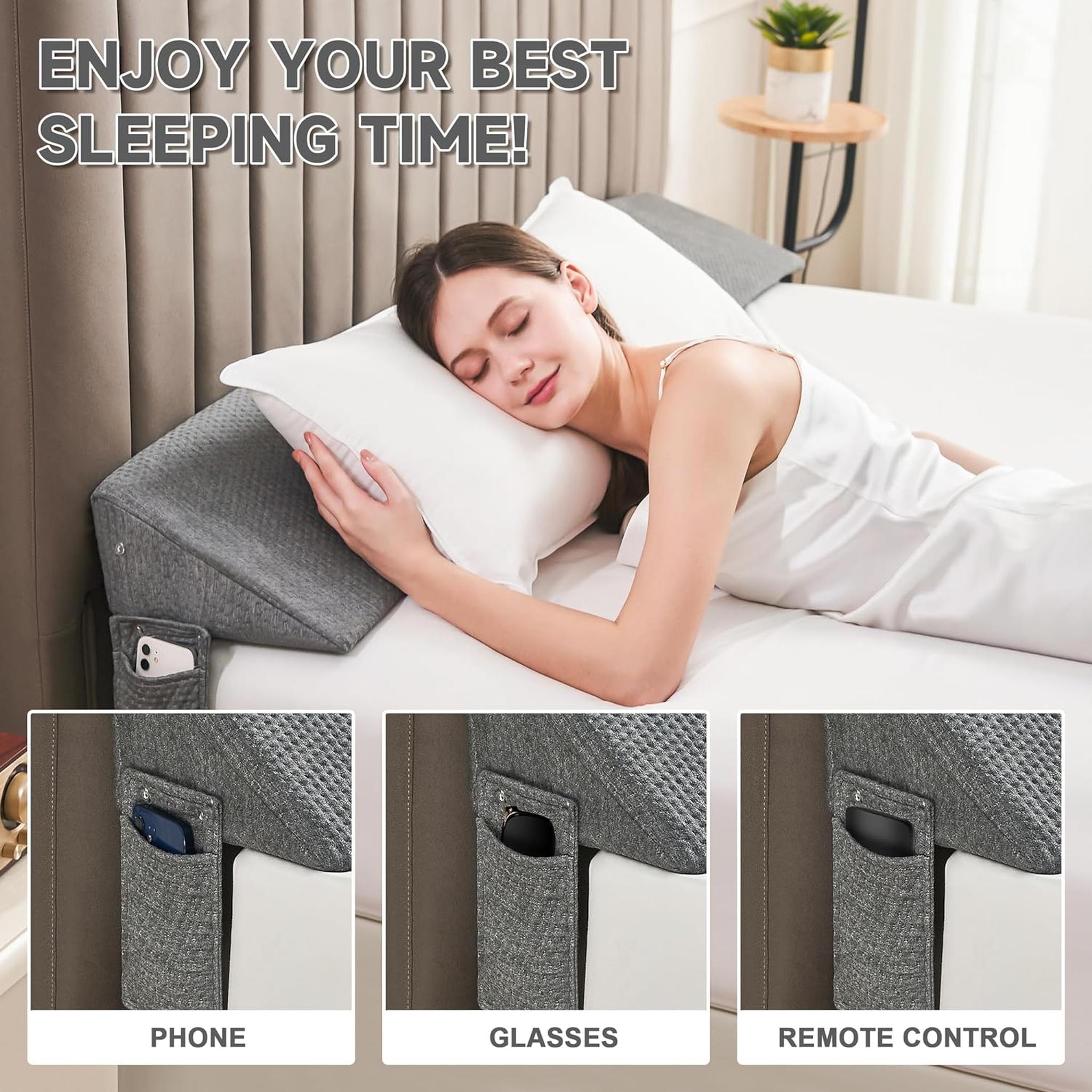 Woman sleeping soundly on a bed with a gray ElevateWedge gap filler pillow and side pockets for phone, glasses, and remote.