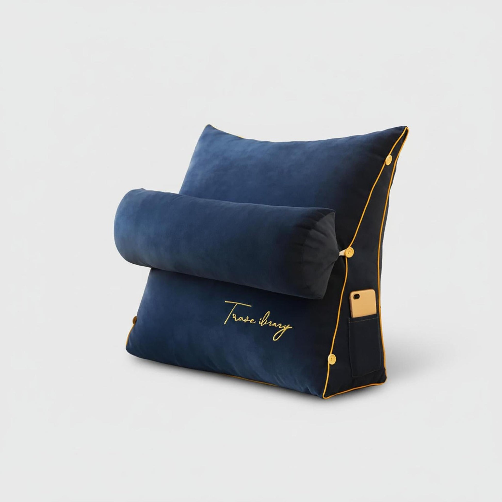 Navy blue ergonomic wedge lumbar support pillow with a removable bolster, gold trim, and side pocket.