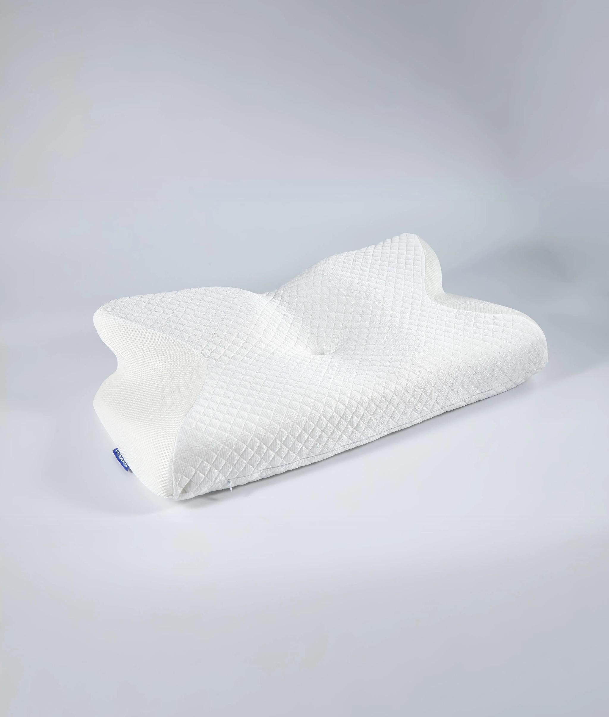 White ergonomic memory foam neck pillow with a butterfly shape and quilted texture.