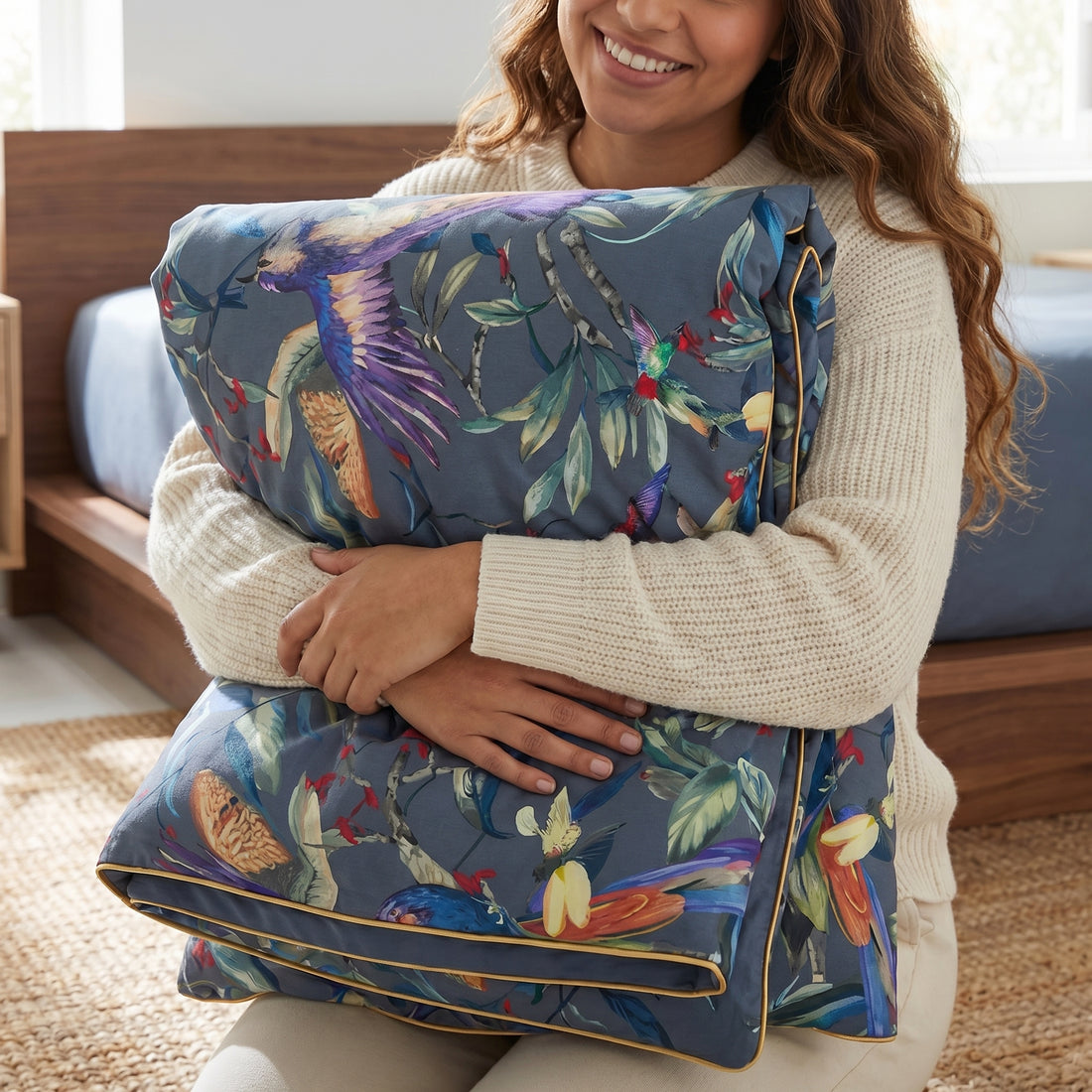 Couple in bed with Festival Floral Bedding Set, featuring painterly florals in crimson, violet, and golden tones on cotton sateen.