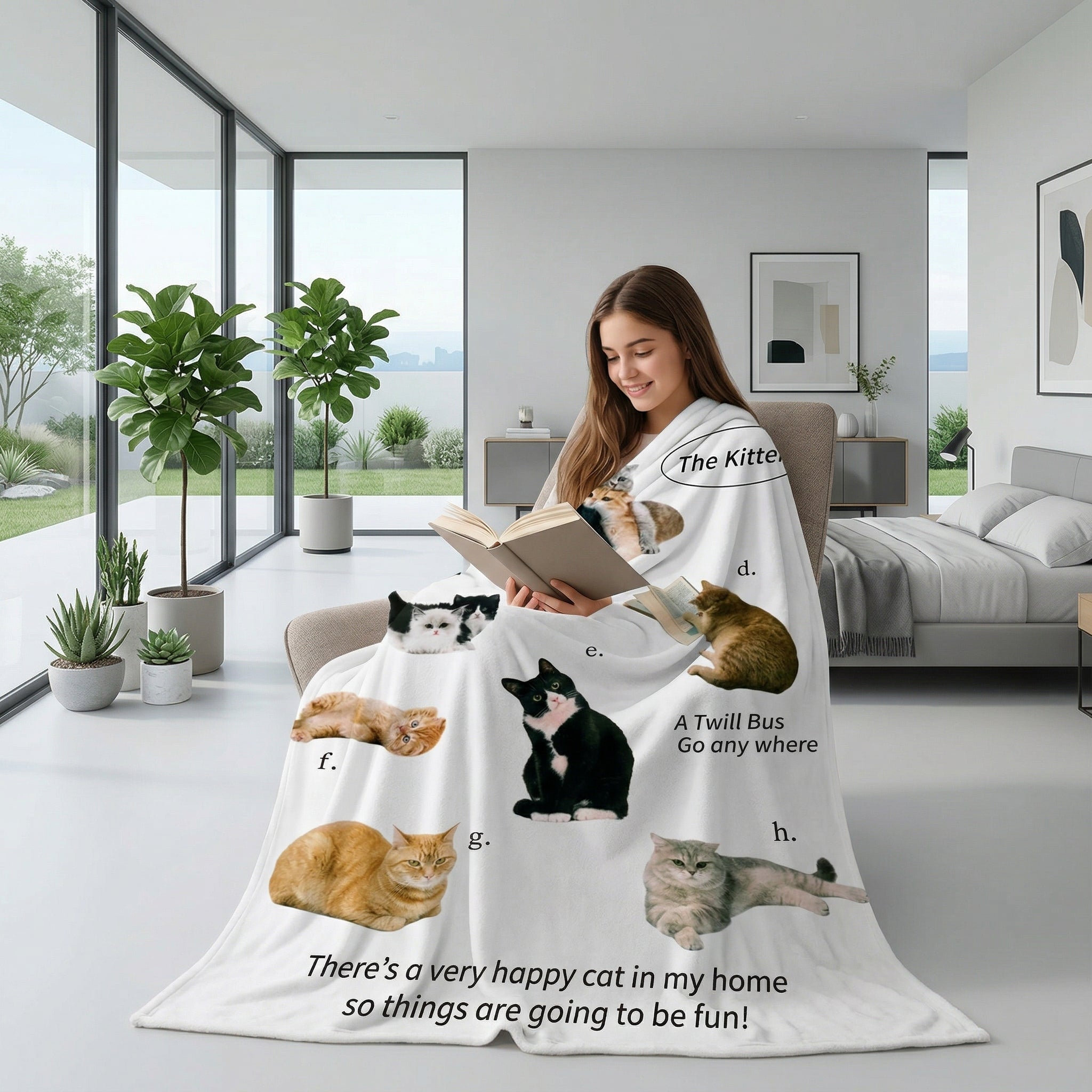 Woman wrapped in a white flannel throw blanket with various cat illustrations and text, reading a book in a modern room.