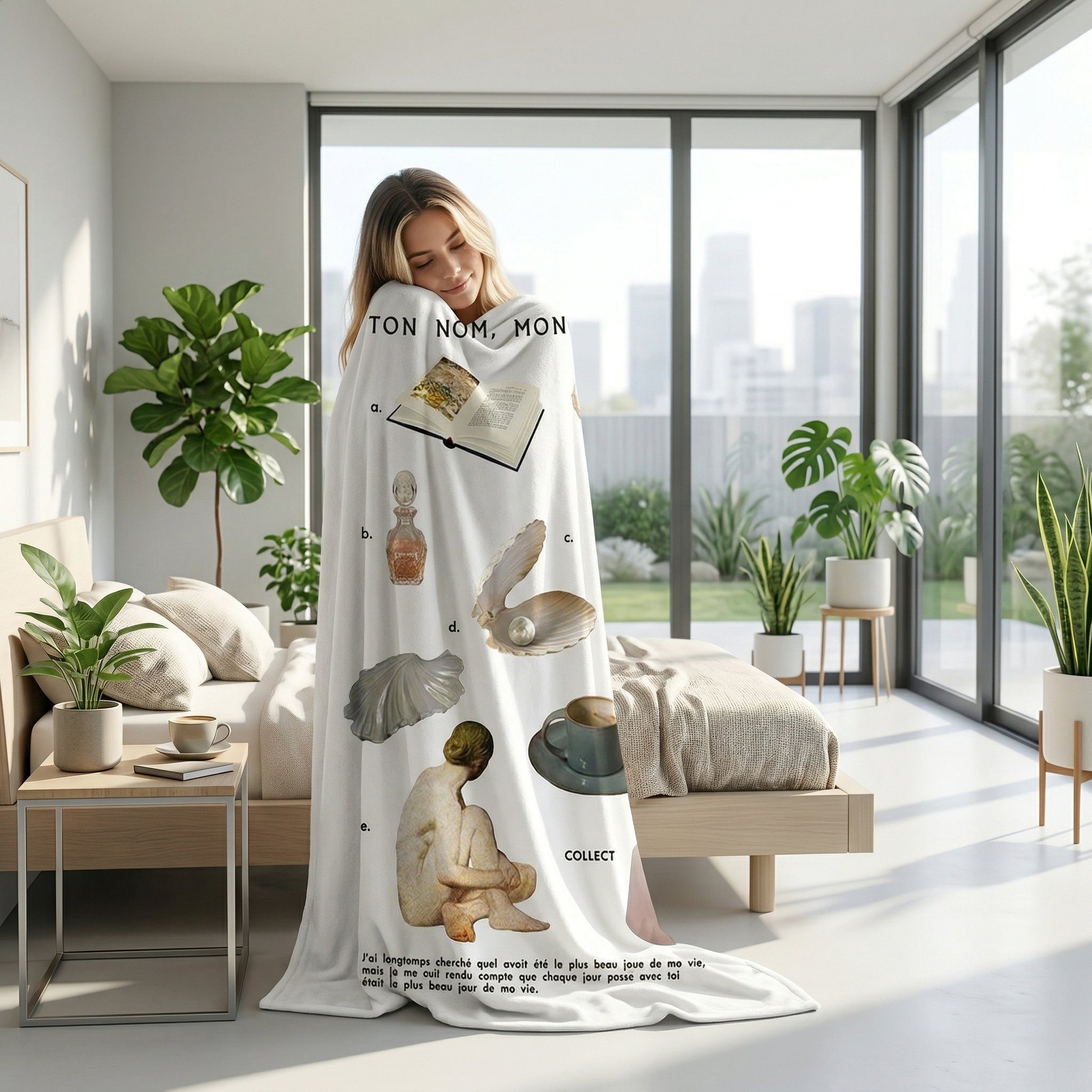 Woman wrapped in a white flannel throw blanket with artistic illustrations, in a bright bedroom with plants.