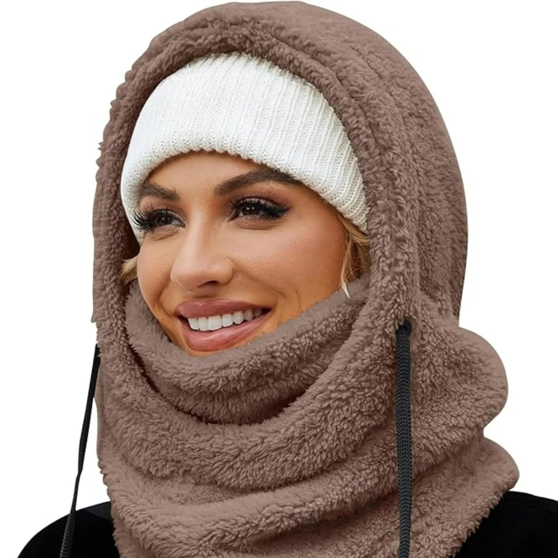 Woman wearing a brown fleece-lined hooded beanie scarf with a white knit beanie.
