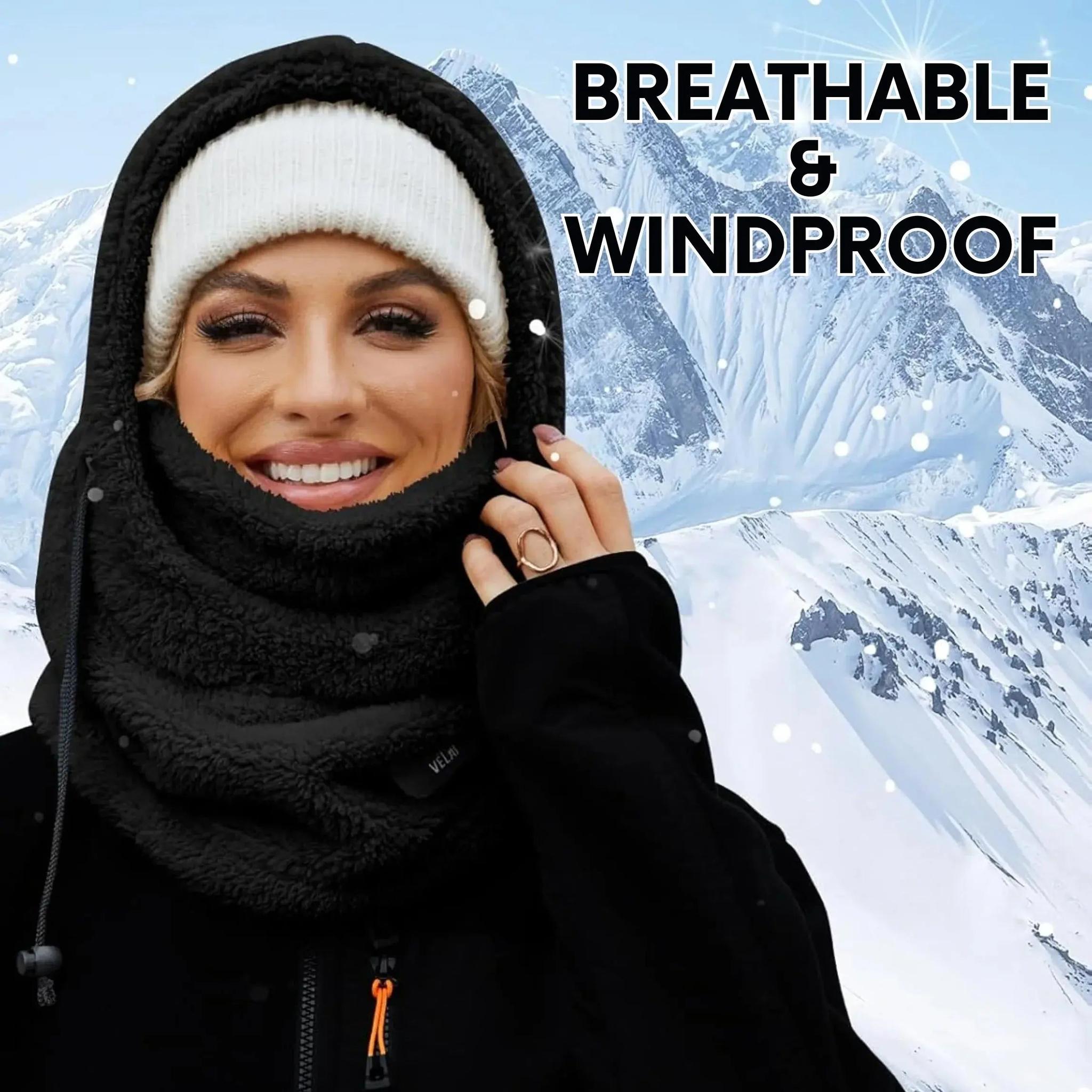 Woman wearing a black fleece-lined hooded beanie scarf with a white knit hat in snowy mountains.
