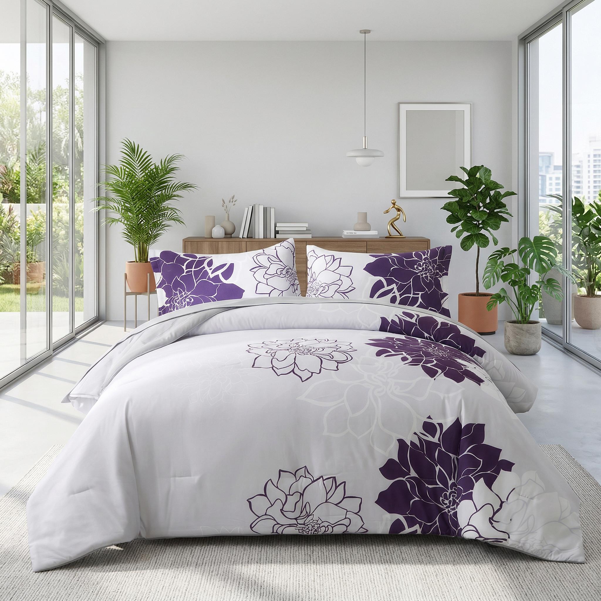 White and purple floral pinch pleat microfiber bedding set on a bed in a bright room.
