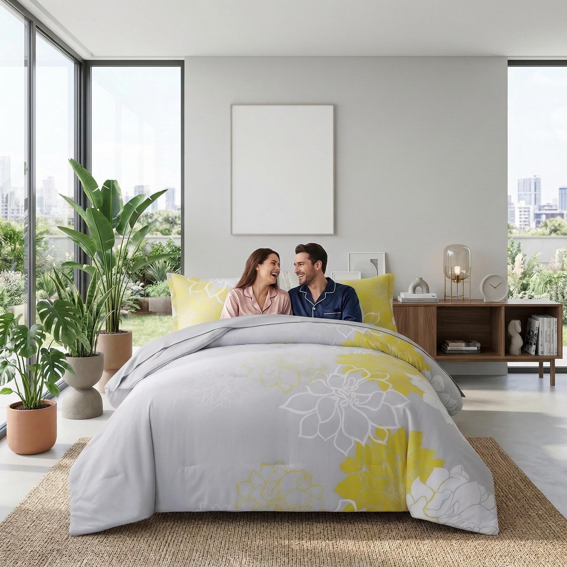 Couple on a bed with a grey and yellow floral reversible microfiber bedding set.
