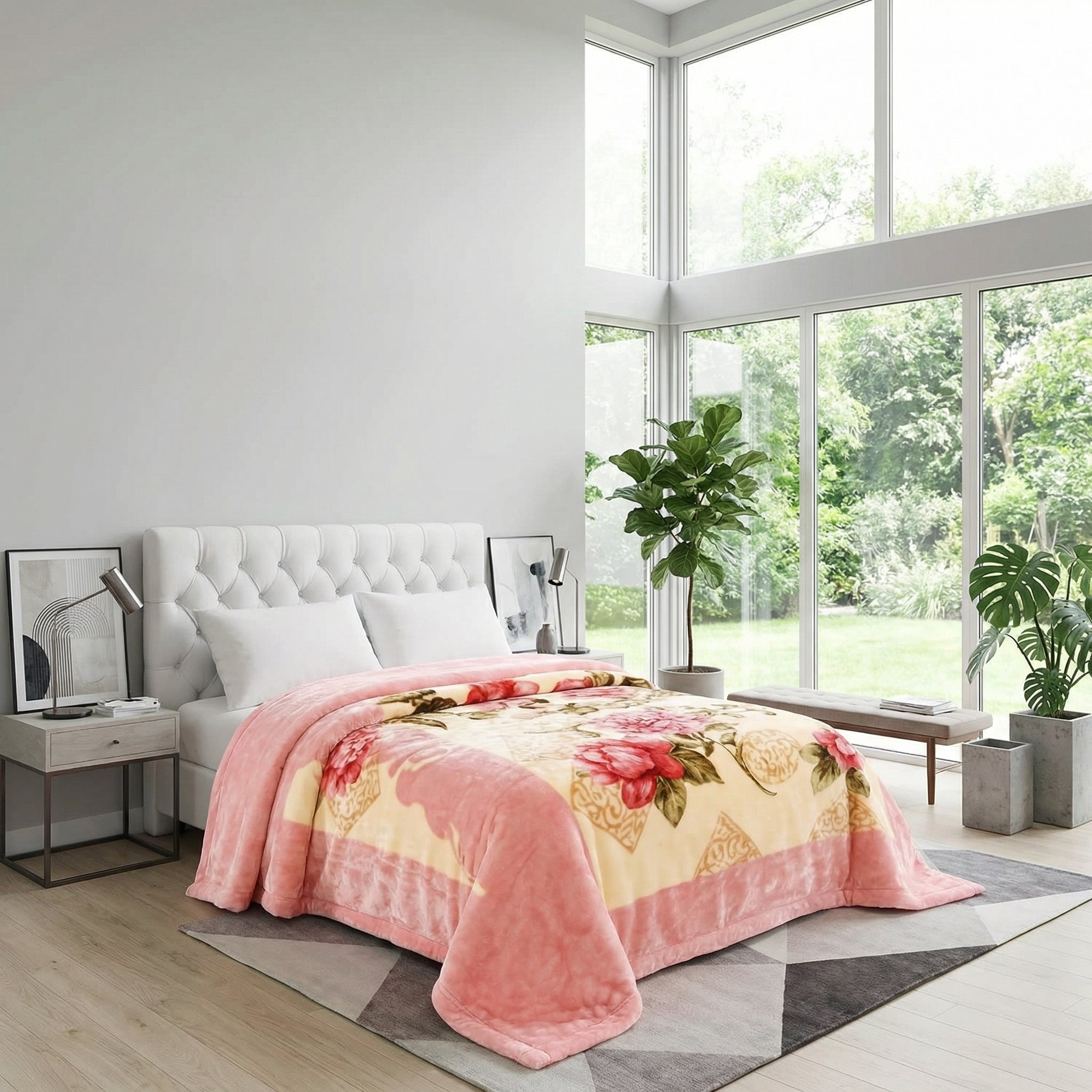 Pink floral design microfiber fleece throw blanket on a white bed in a bright bedroom.
