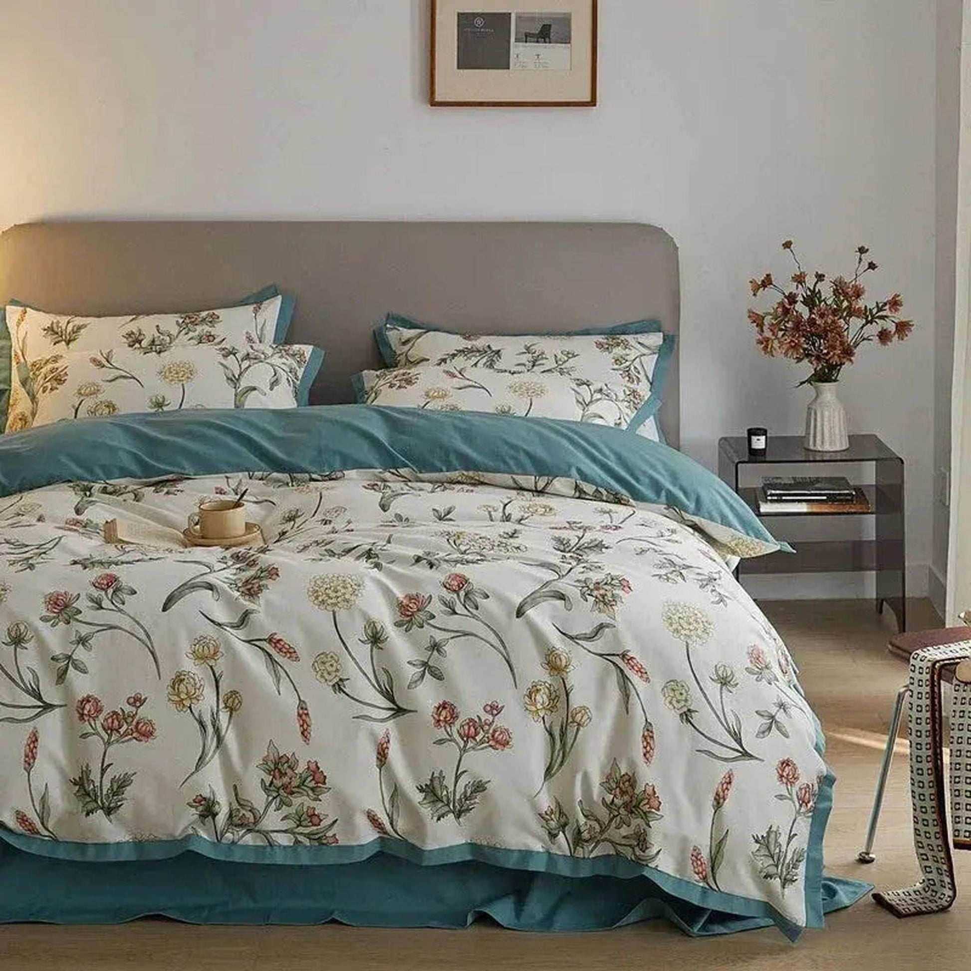 White microfiber floral duvet cover set with teal trim, featuring a botanical pattern on a bed.