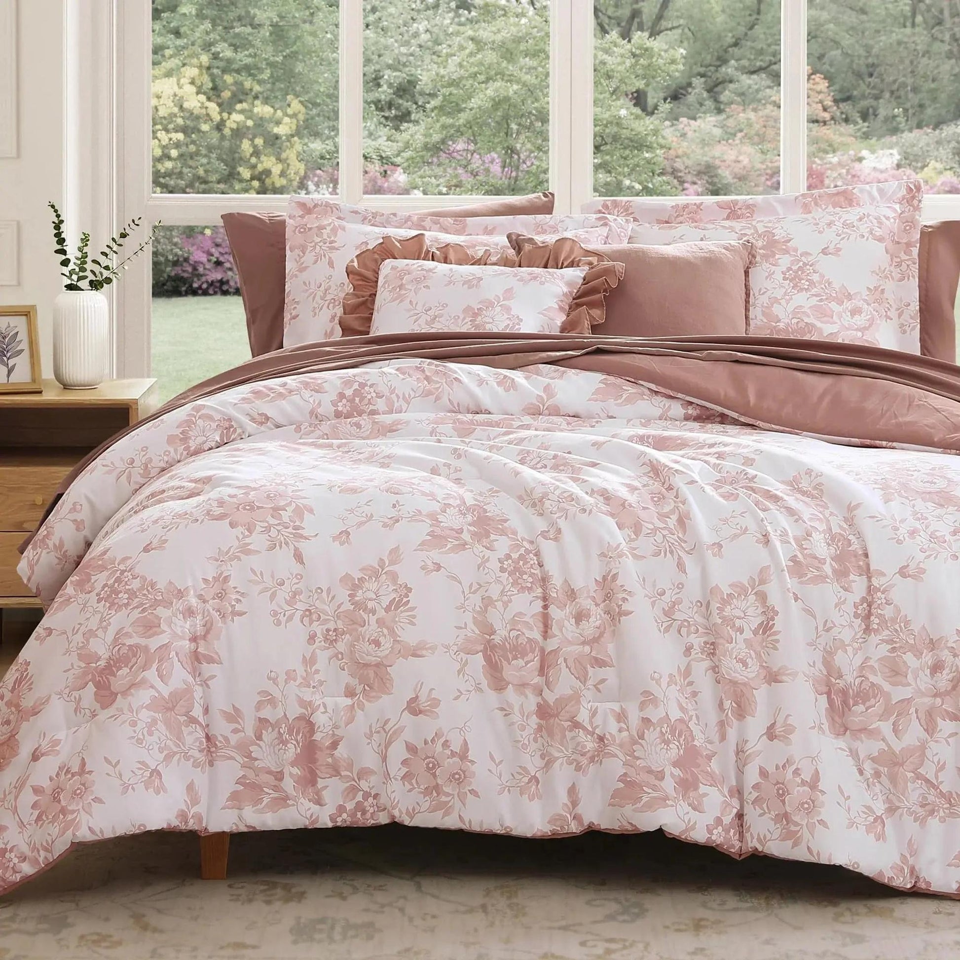 White and pink floral microfiber duvet cover set with matching pillowcases on a bed.