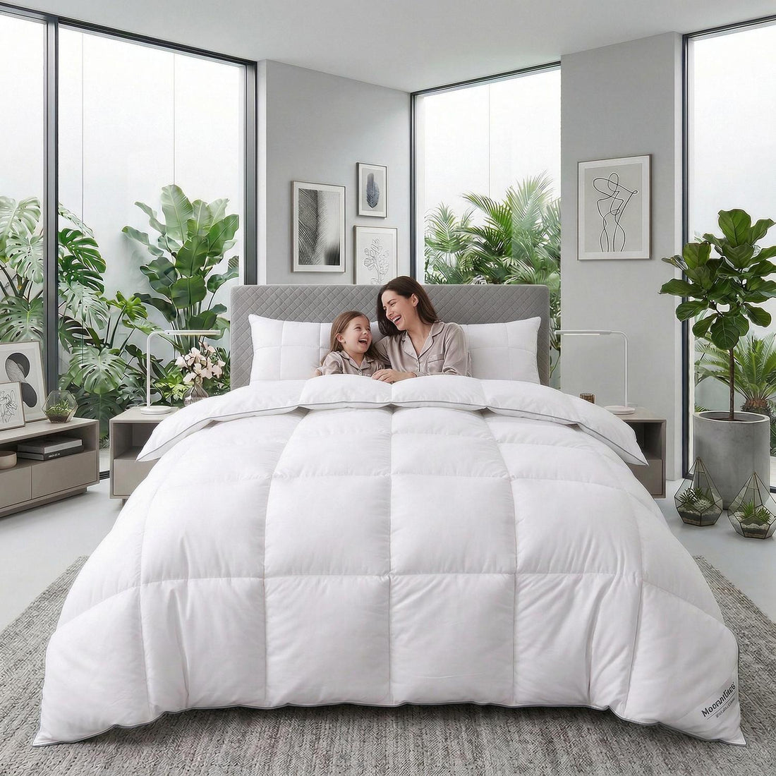 Fluffy white quilted duvet comforter on a bed with a mother and child, surrounded by plants.