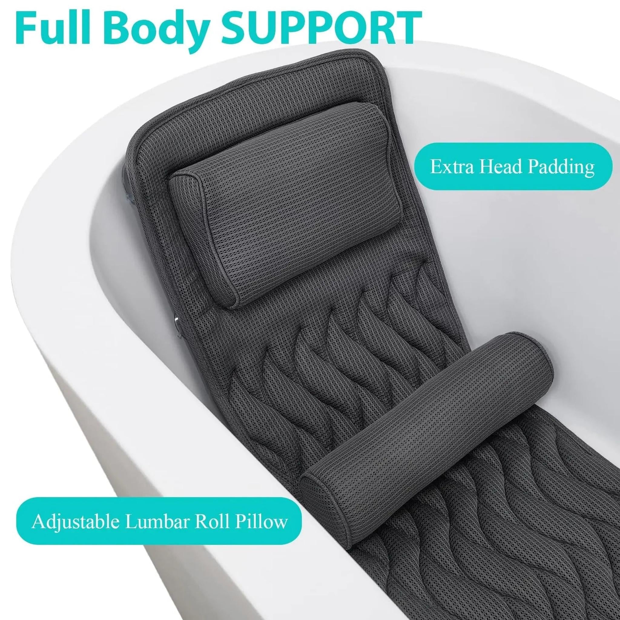 Grey full body bath pillow with extra head padding and adjustable lumbar roll in a white tub.
