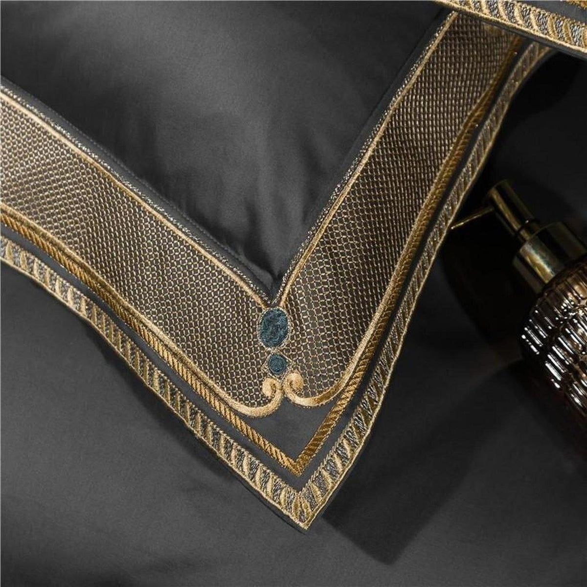 Luxury gray Egyptian cotton duvet cover with intricate gold embroidered border detailing.