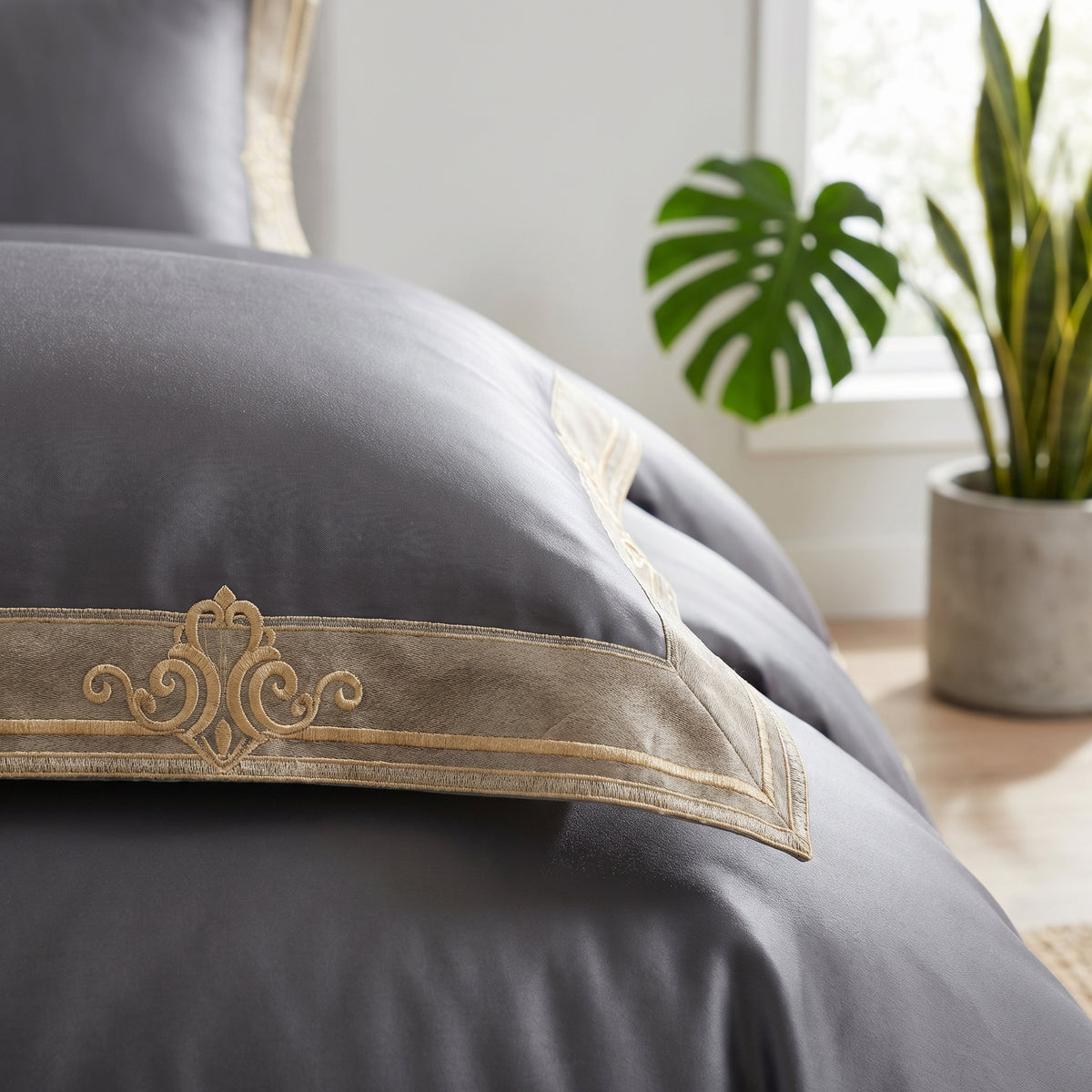 Luxury gray Egyptian cotton duvet cover with elegant gold embroidery and a smooth, high-thread-count finish.