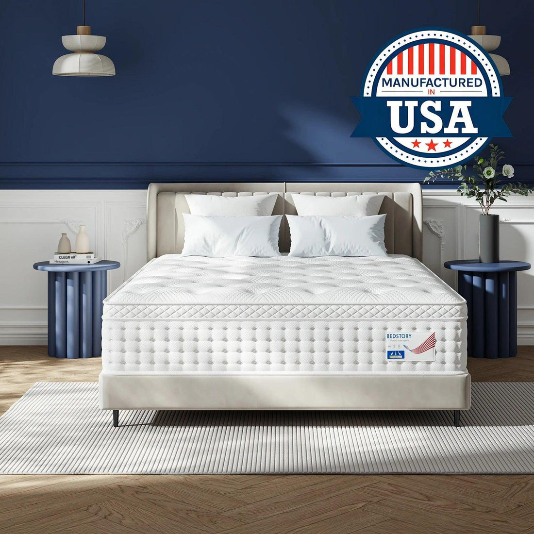 Woman sitting on a white queen-size hybrid mattress with pocket springs and tufted memory foam in a modern bedroom.