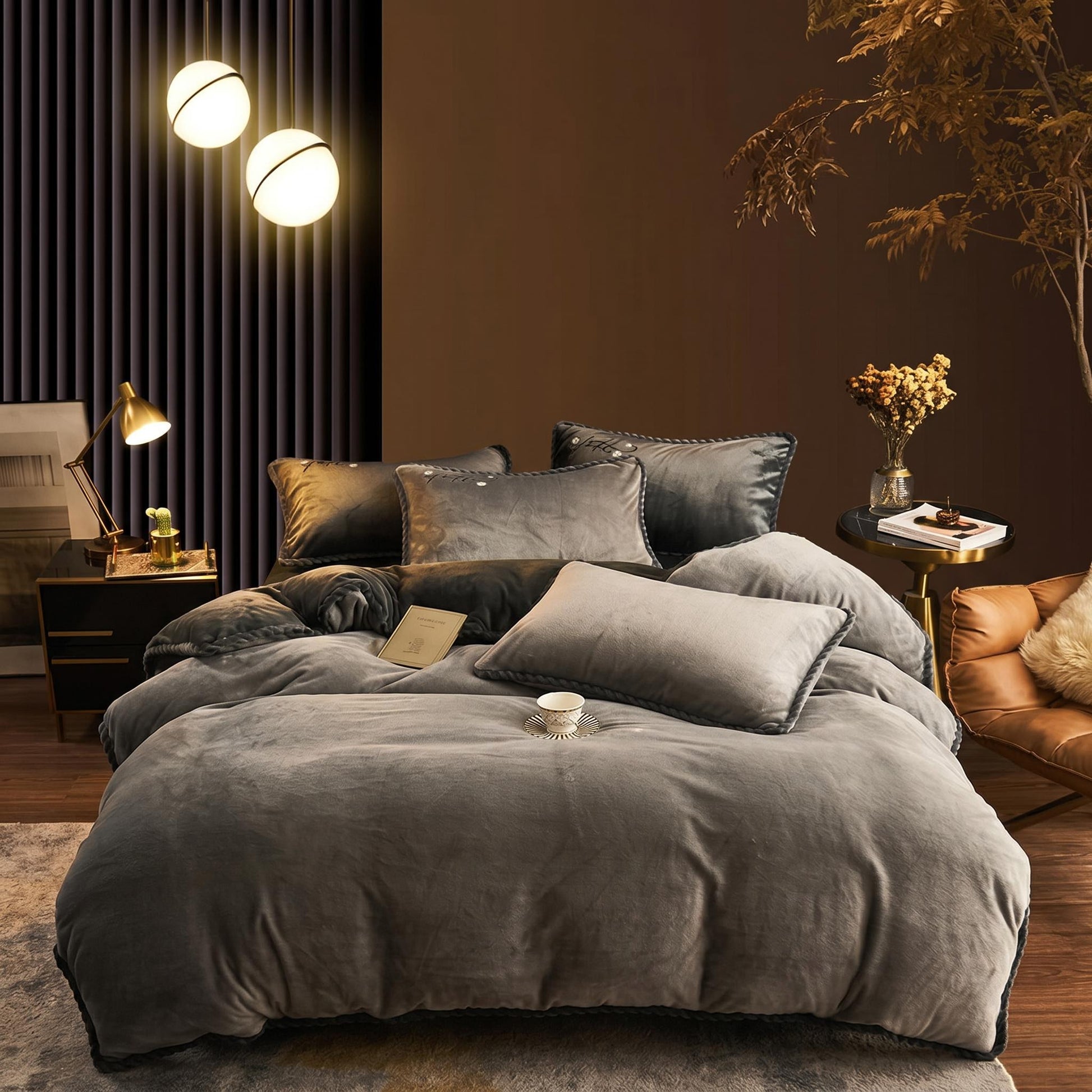 Thickened grey lamb wool fleece blanket set on a bed in a cozy, modern bedroom.