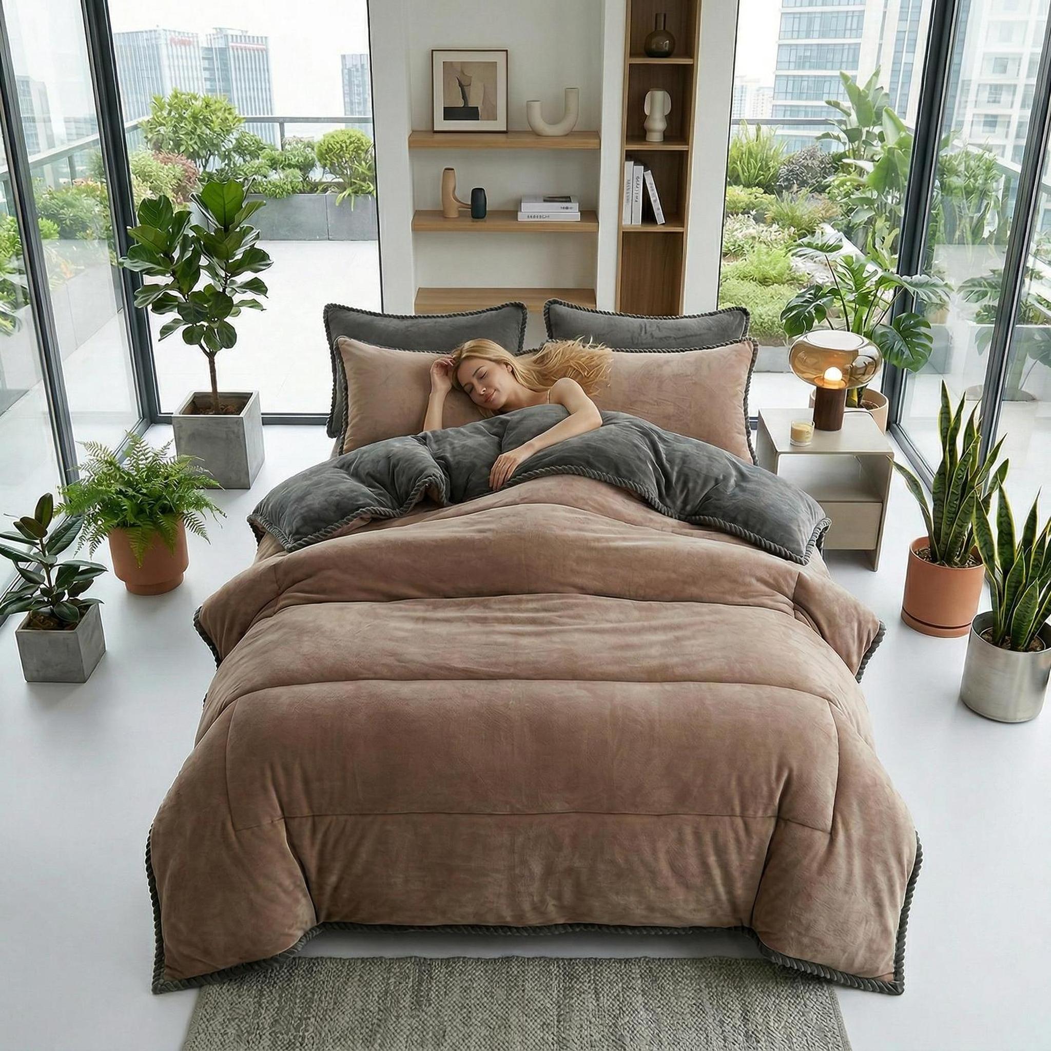 Thickened lamb wool blanket in brown and grey on a bed in a modern room.